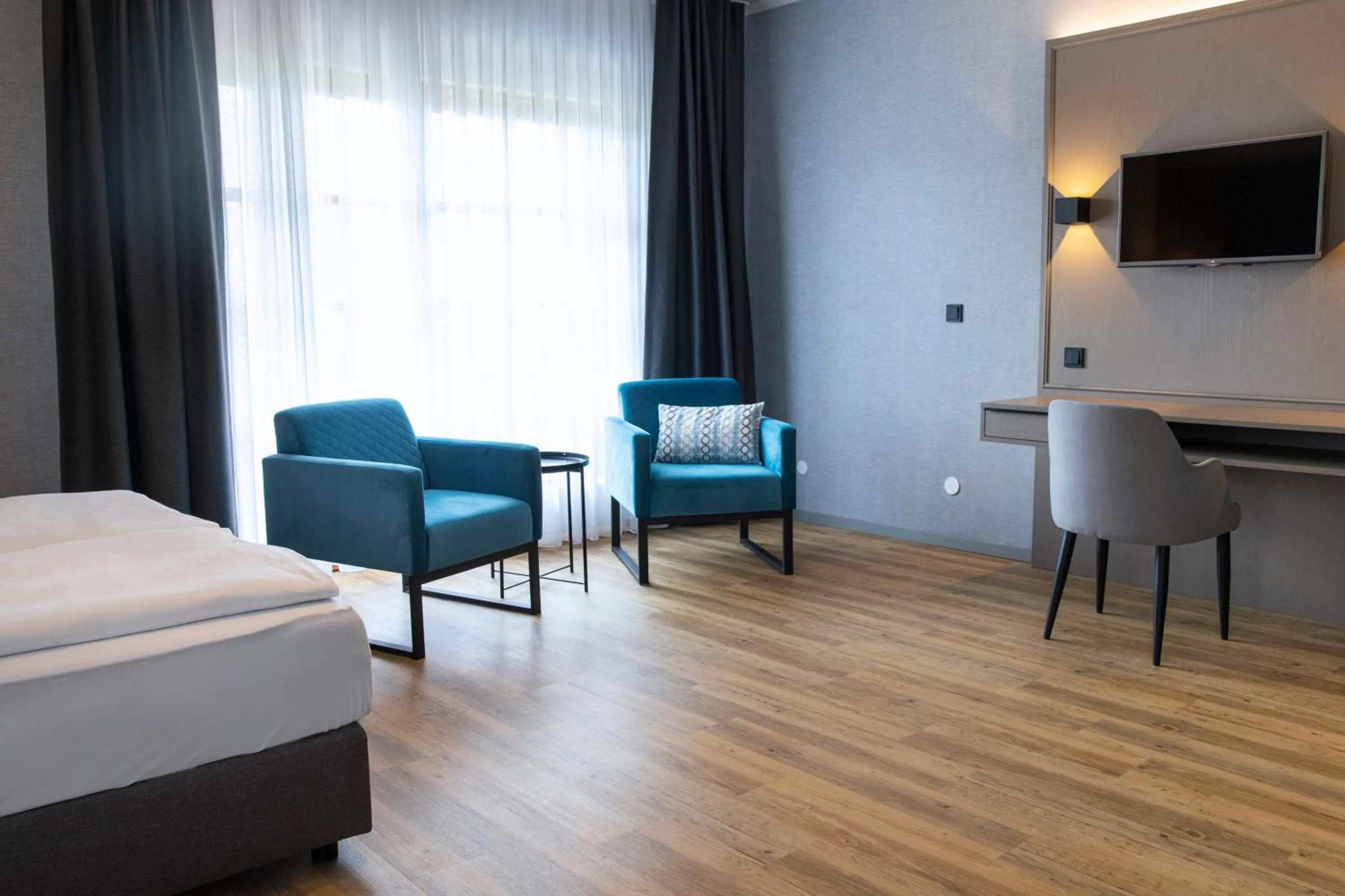 Photo of the whole room, Bed in Roomingtons City Waldkirchen