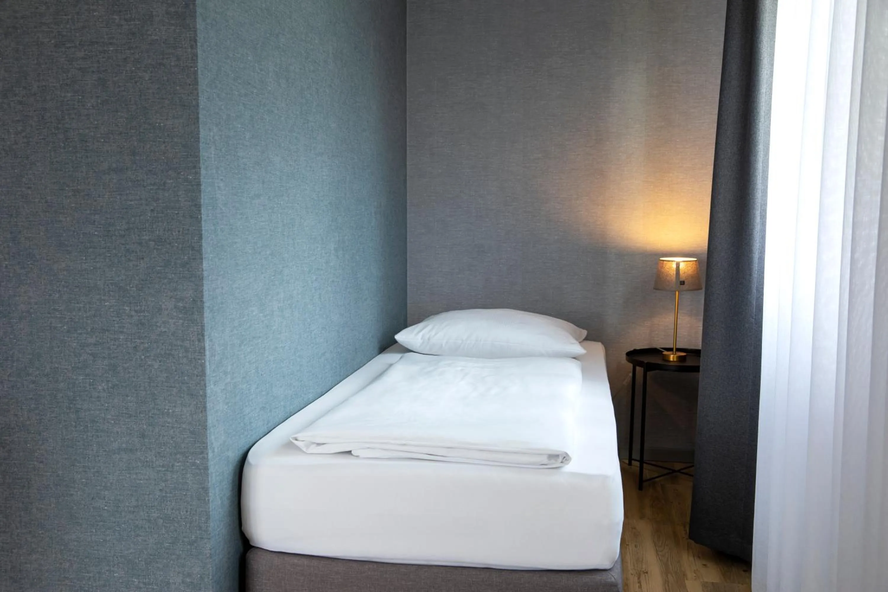 Photo of the whole room, Bed in Roomingtons City Waldkirchen