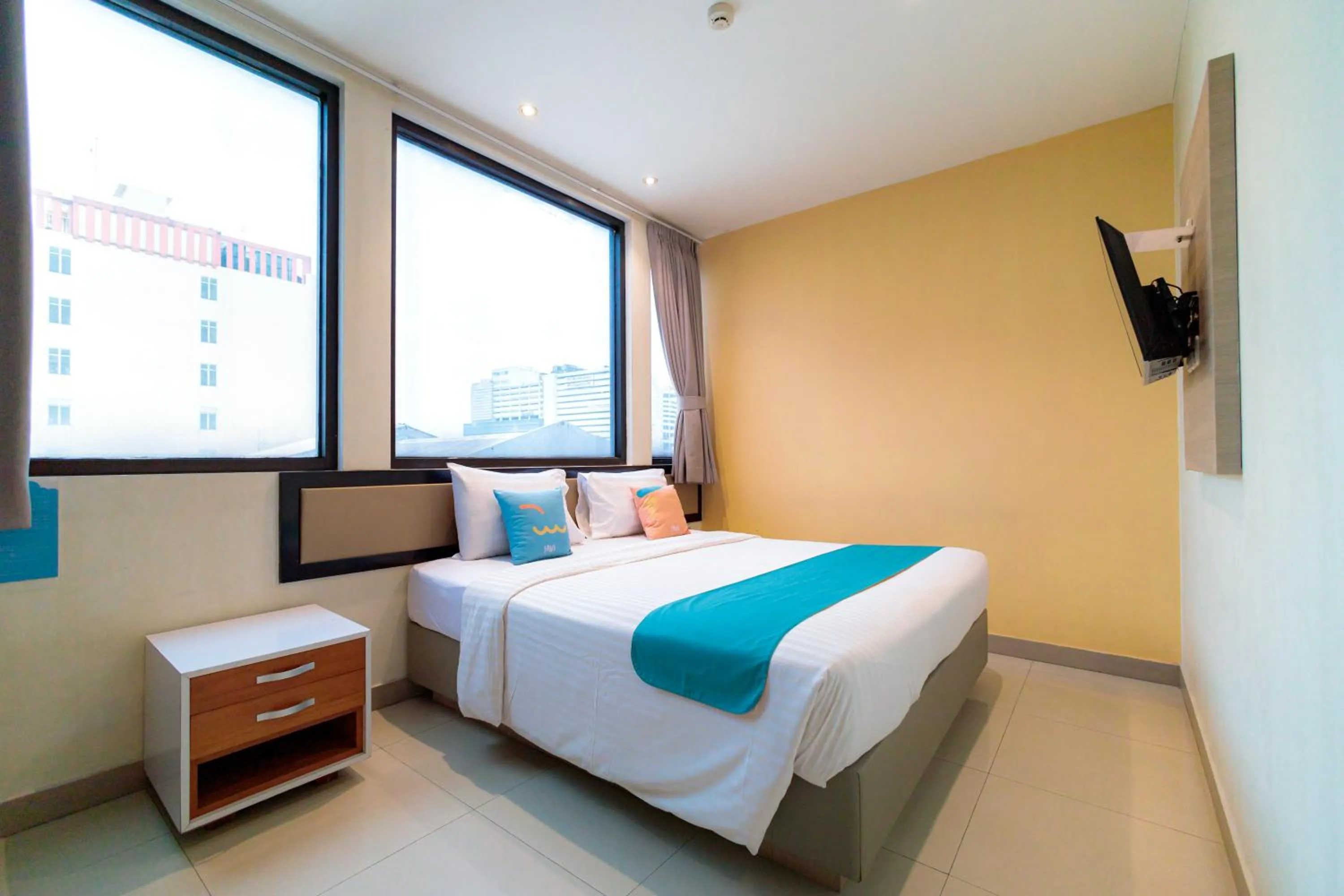 Bedroom, Bed in Sans Hotel Liv Ancol by RedDoorz