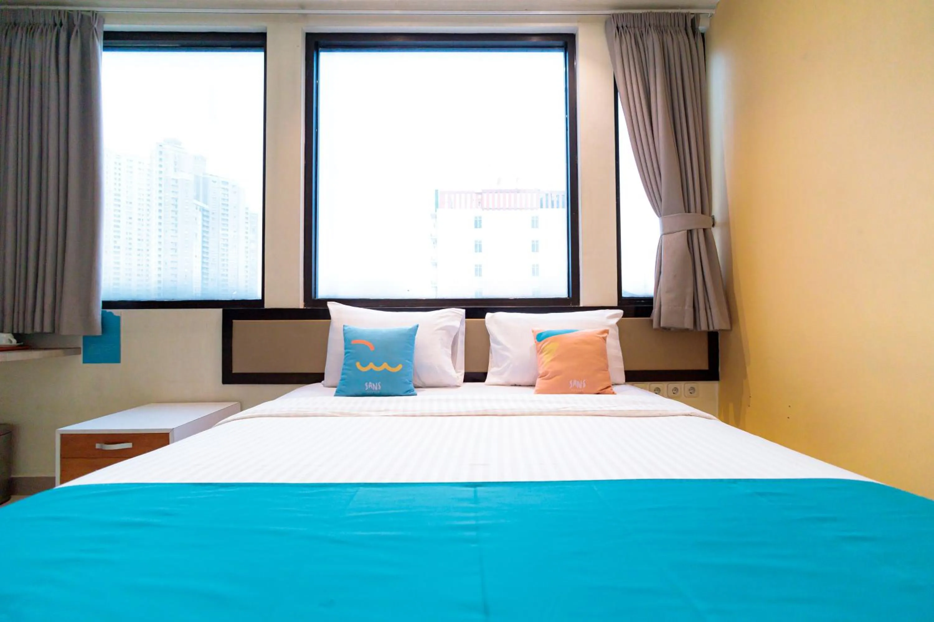 Bedroom, Bed in Sans Hotel Liv Ancol by RedDoorz