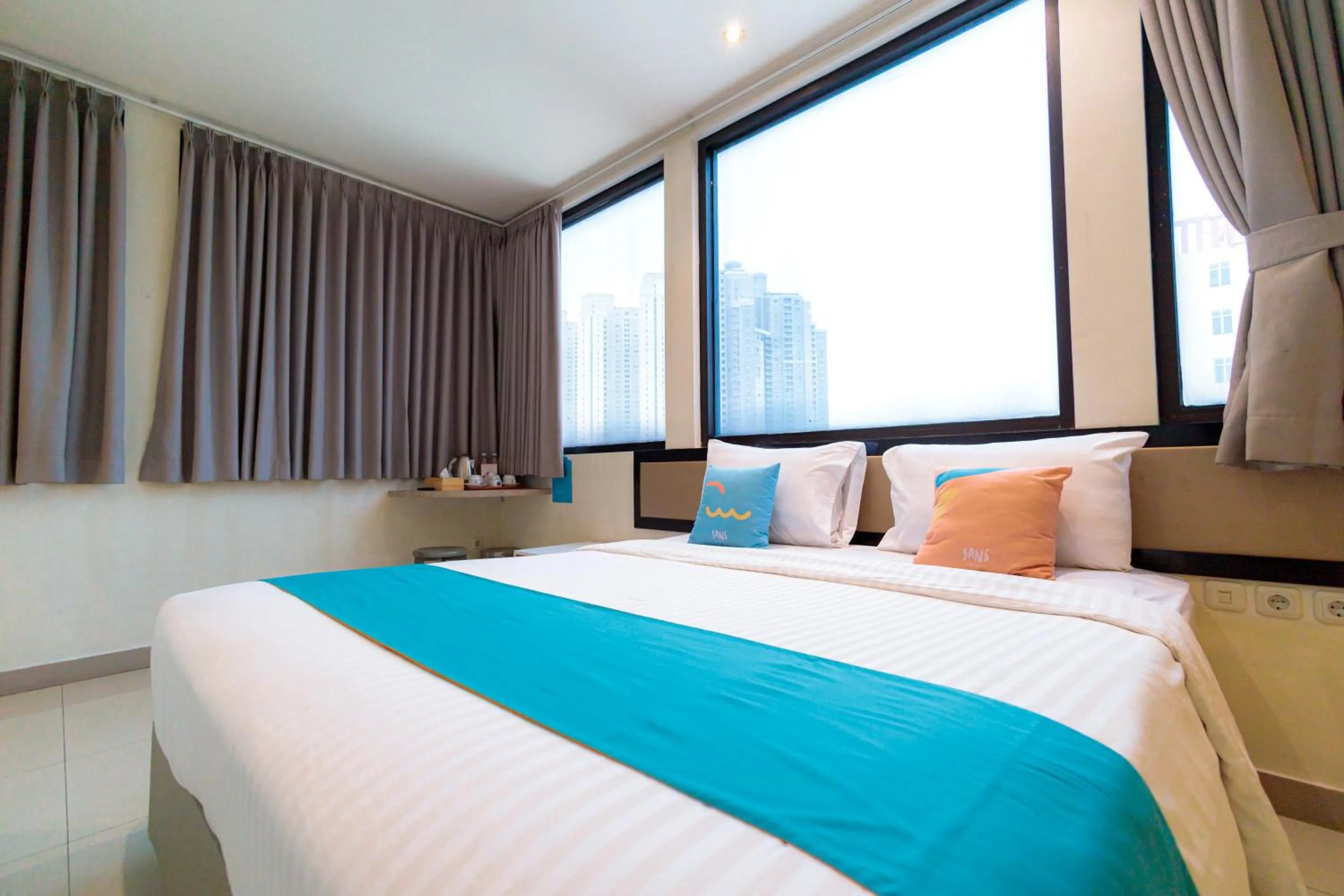 Bedroom, Bed in Sans Hotel Liv Ancol by RedDoorz