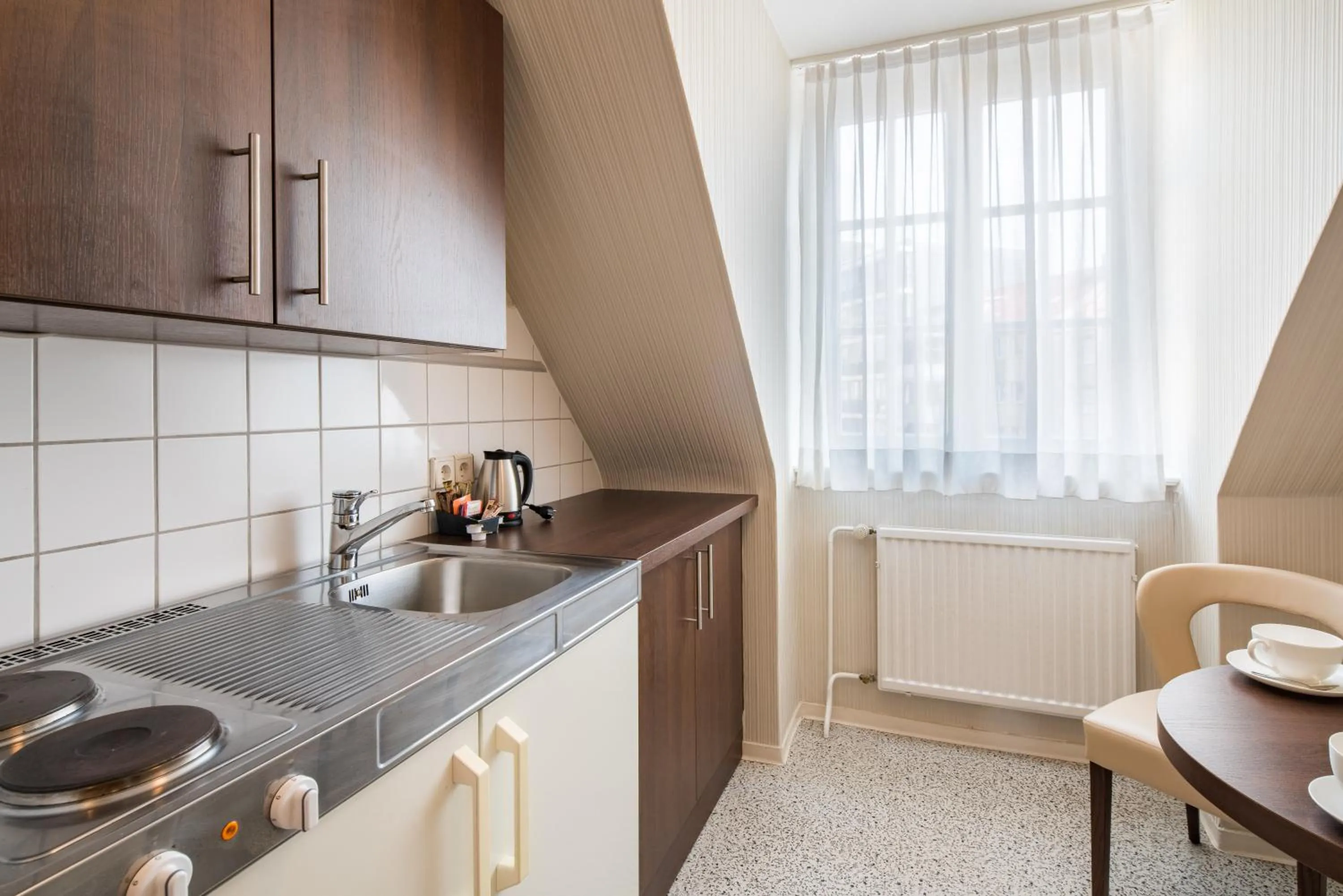 Kitchen or kitchenette in Best Western Plus Hotel StadtPalais