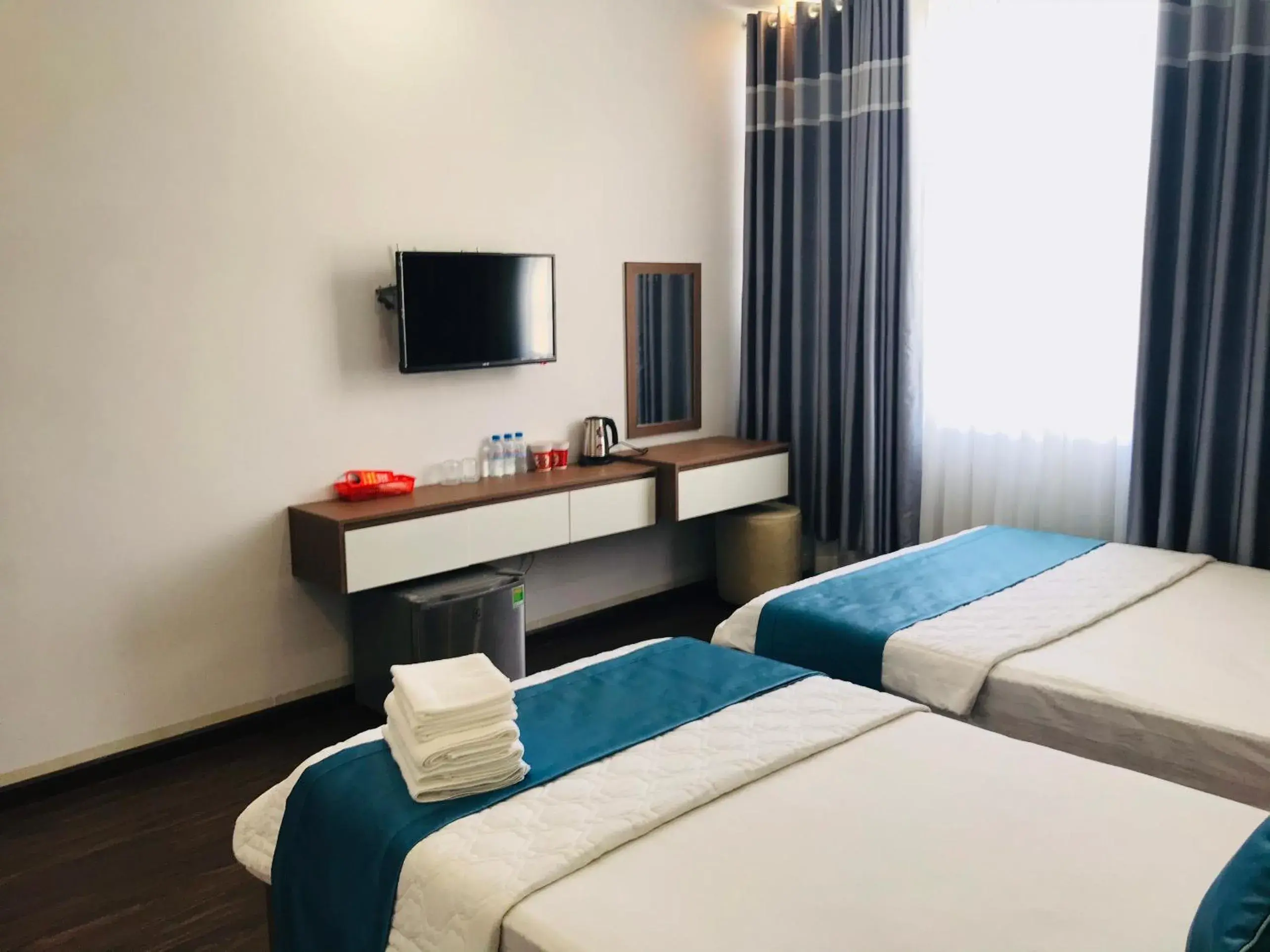 Communal lounge/ TV room, Bed in Thanh Binh Hotel Con Dao Communal lounge/ TV room, Bed in Thanh Binh Hotel Con Dao