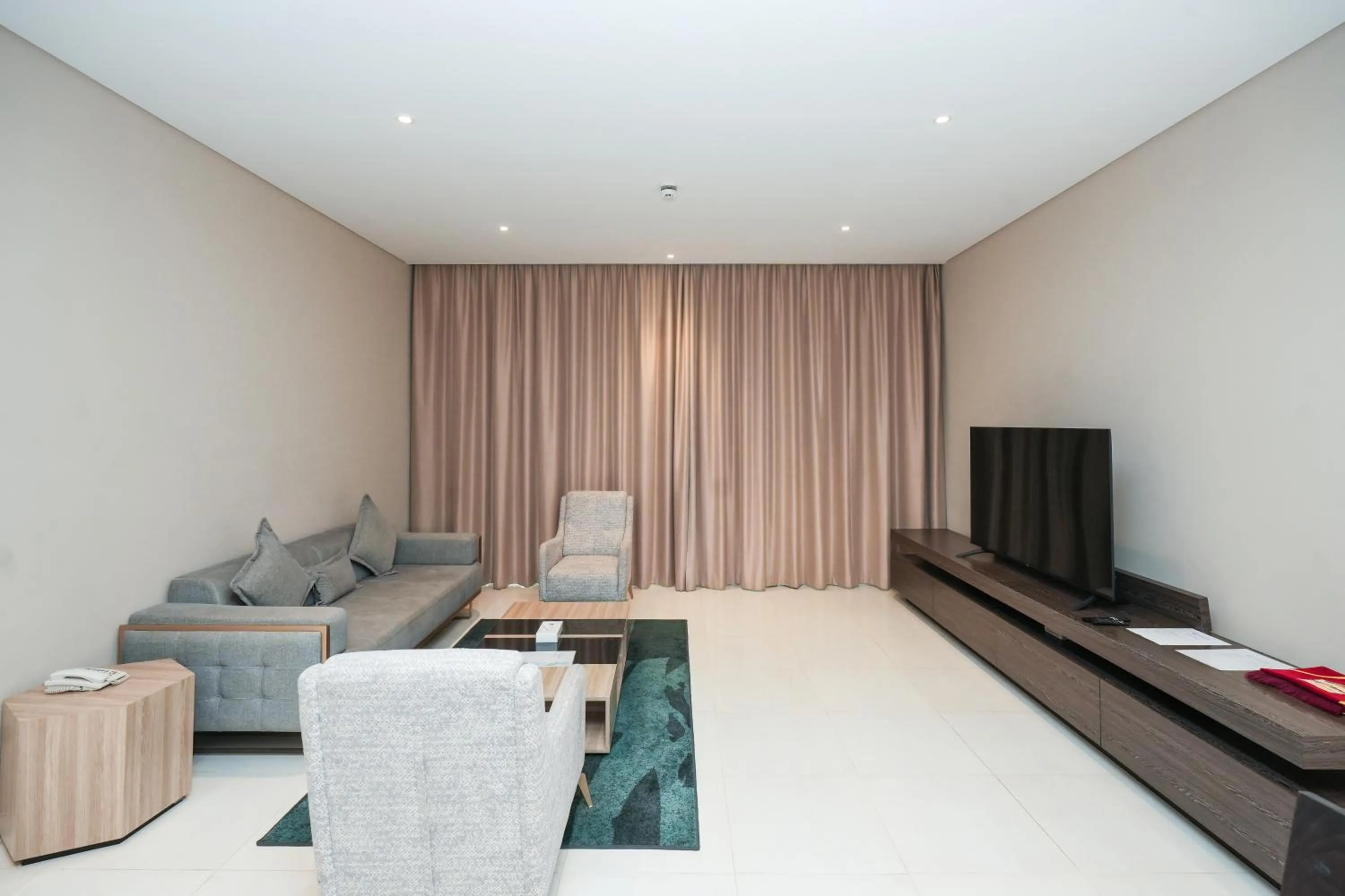 Communal lounge/ TV room in Eden Garden Hotel Apartment