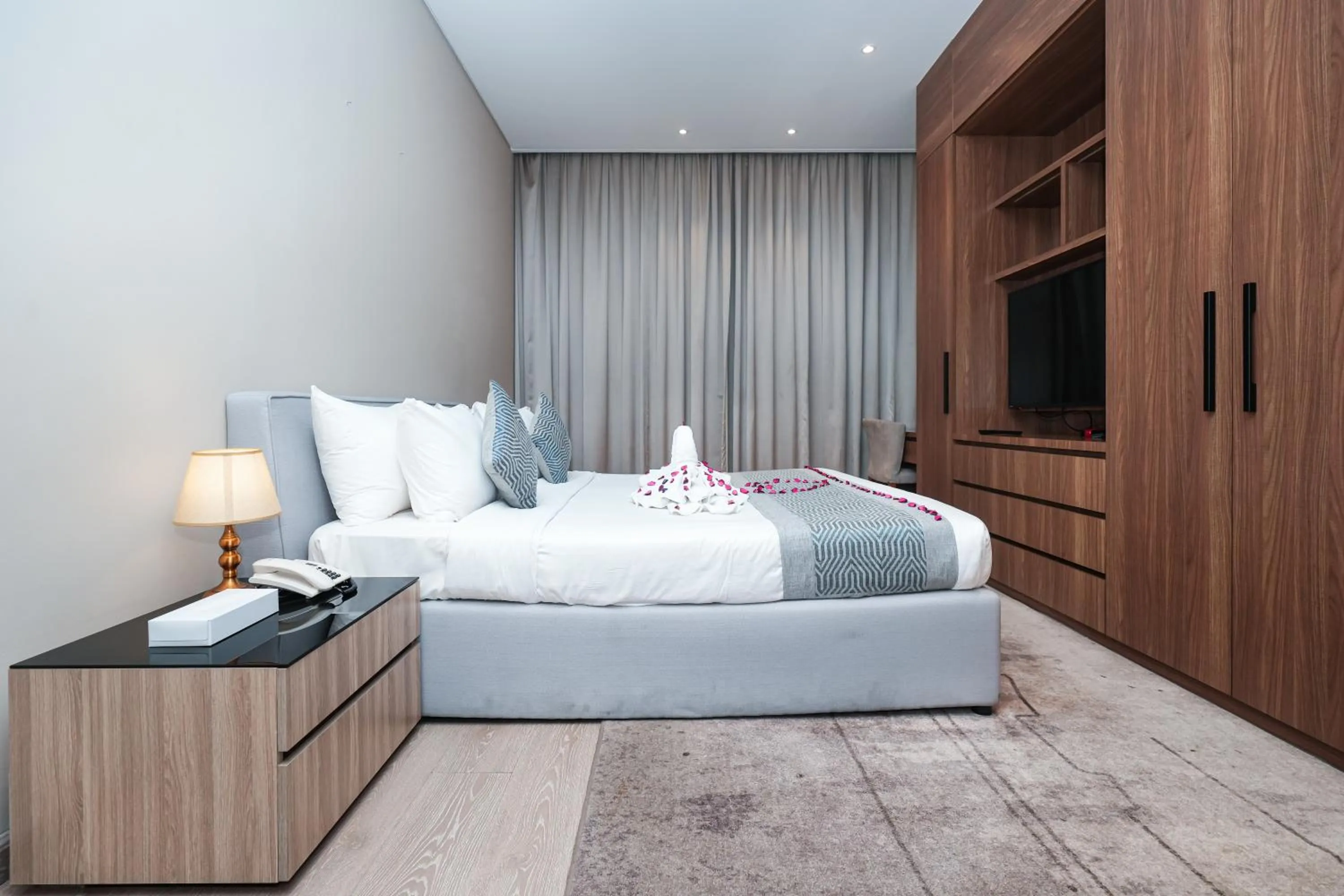 Bed in Eden Garden Hotel Apartment