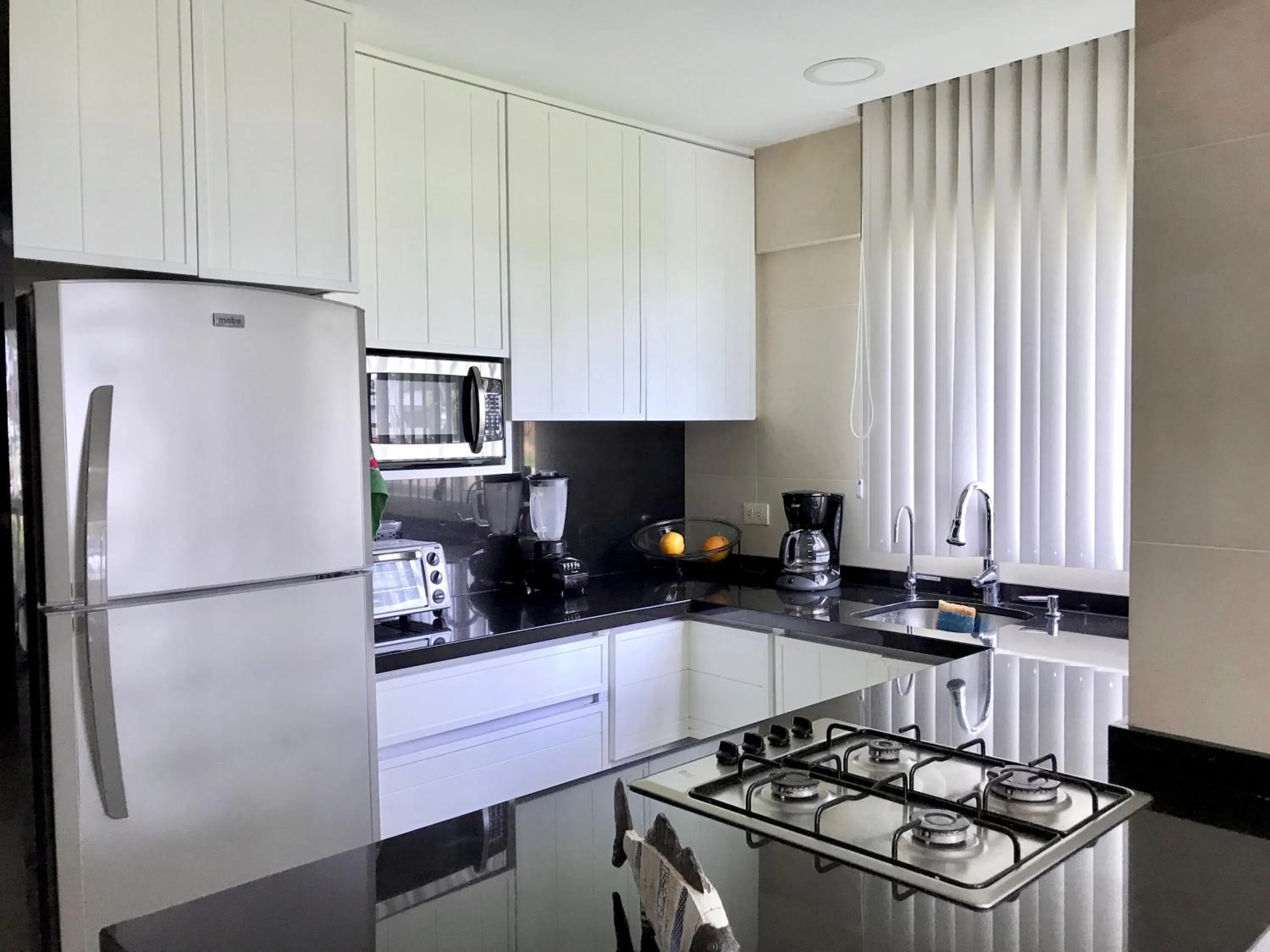 Kitchen or kitchenette in Marina Suites by Andiani Travel