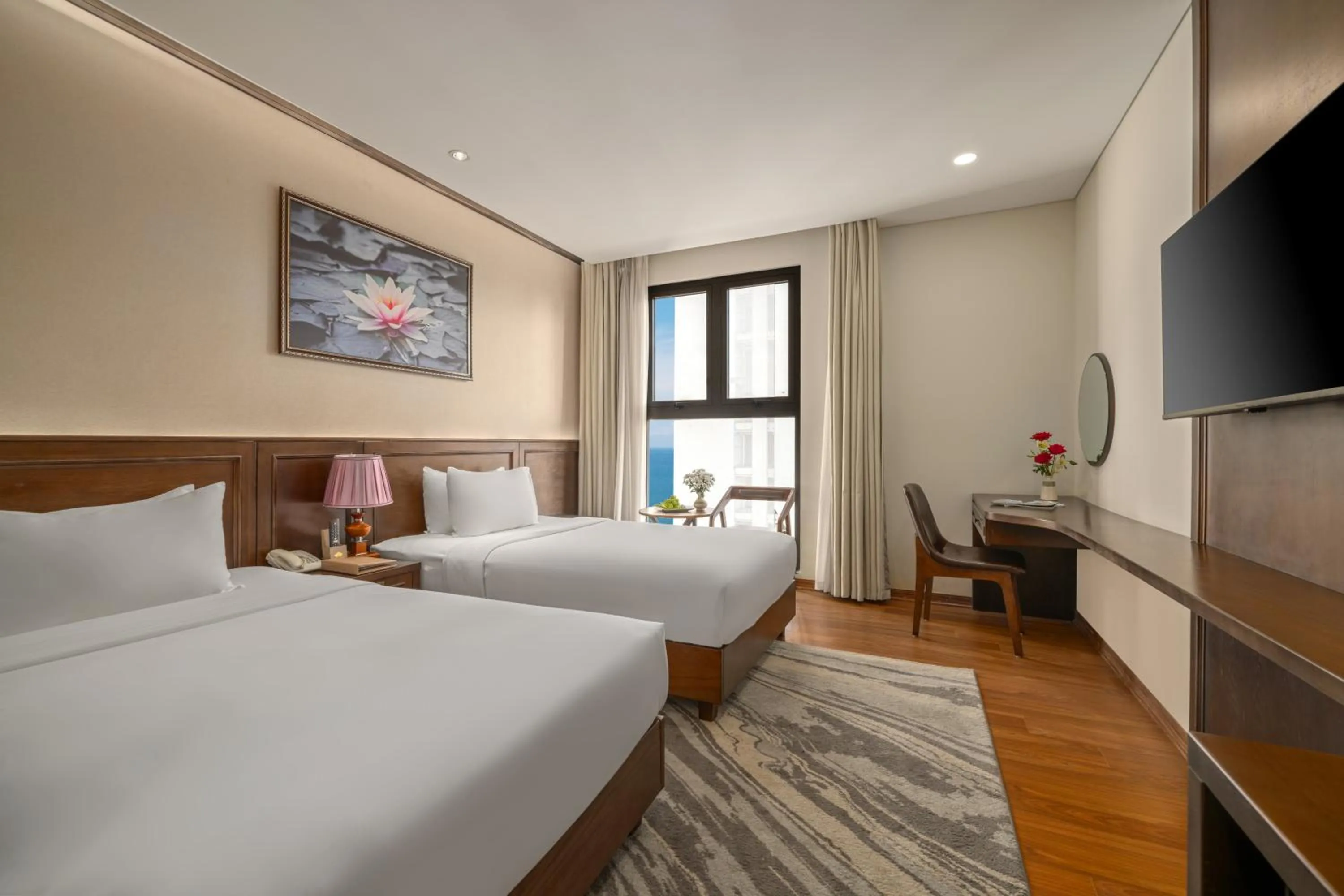 Bed in Golden Lotus Hotel Da Nang - Rooftop Bar Sea View