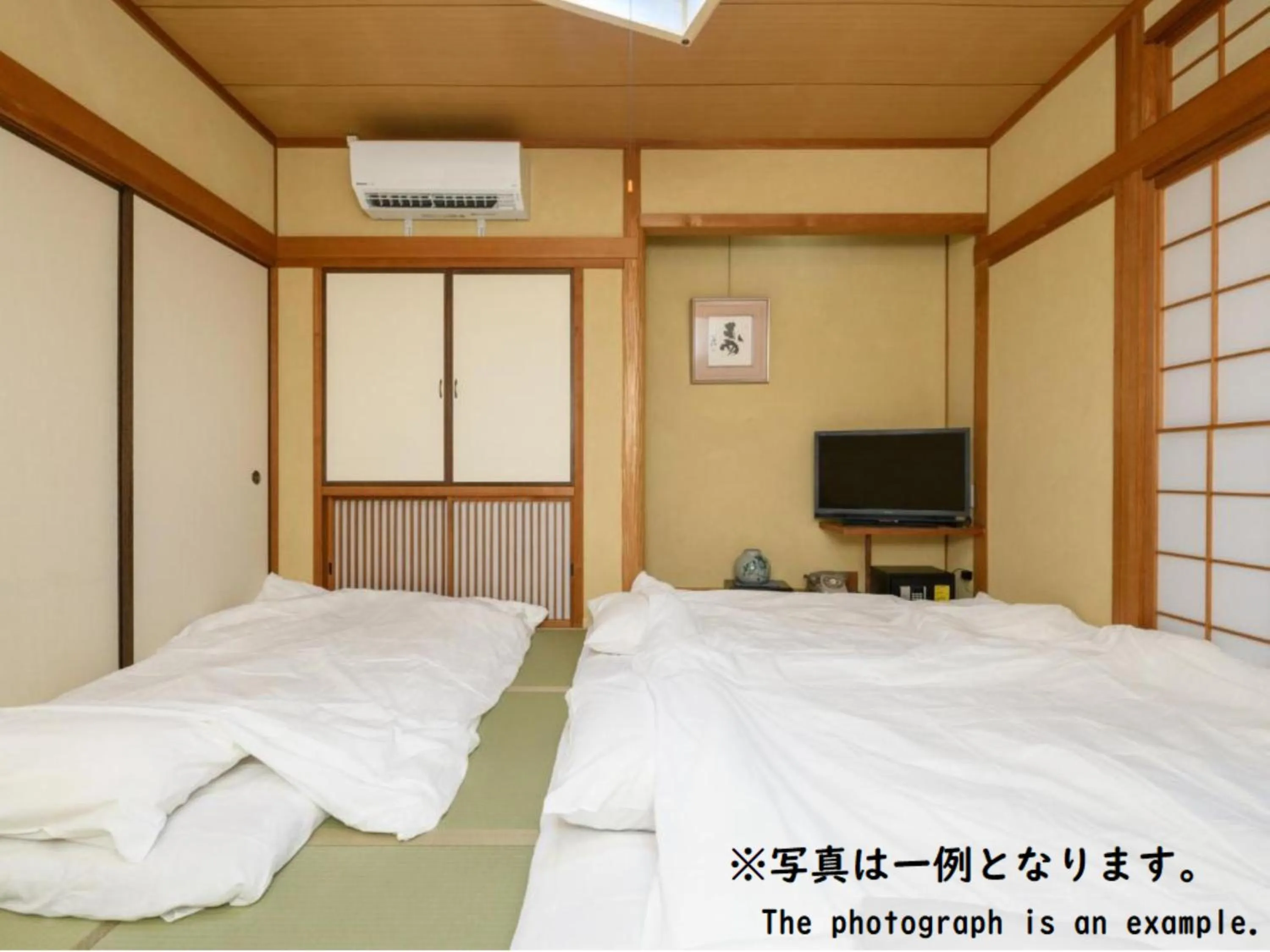 Bed in Tabist Asanokan Annex Iroha Ise