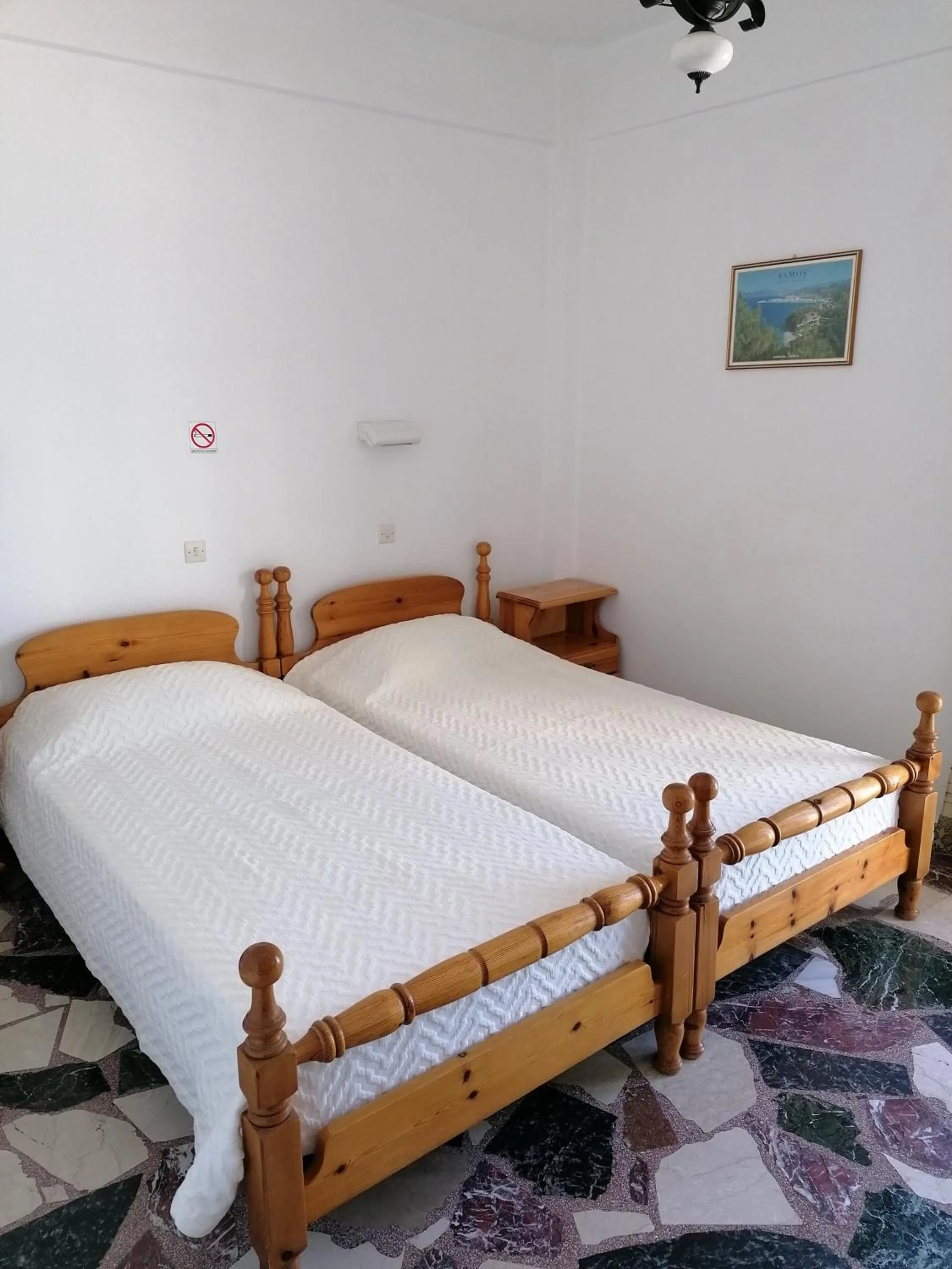Bed in Lefteris Rooms