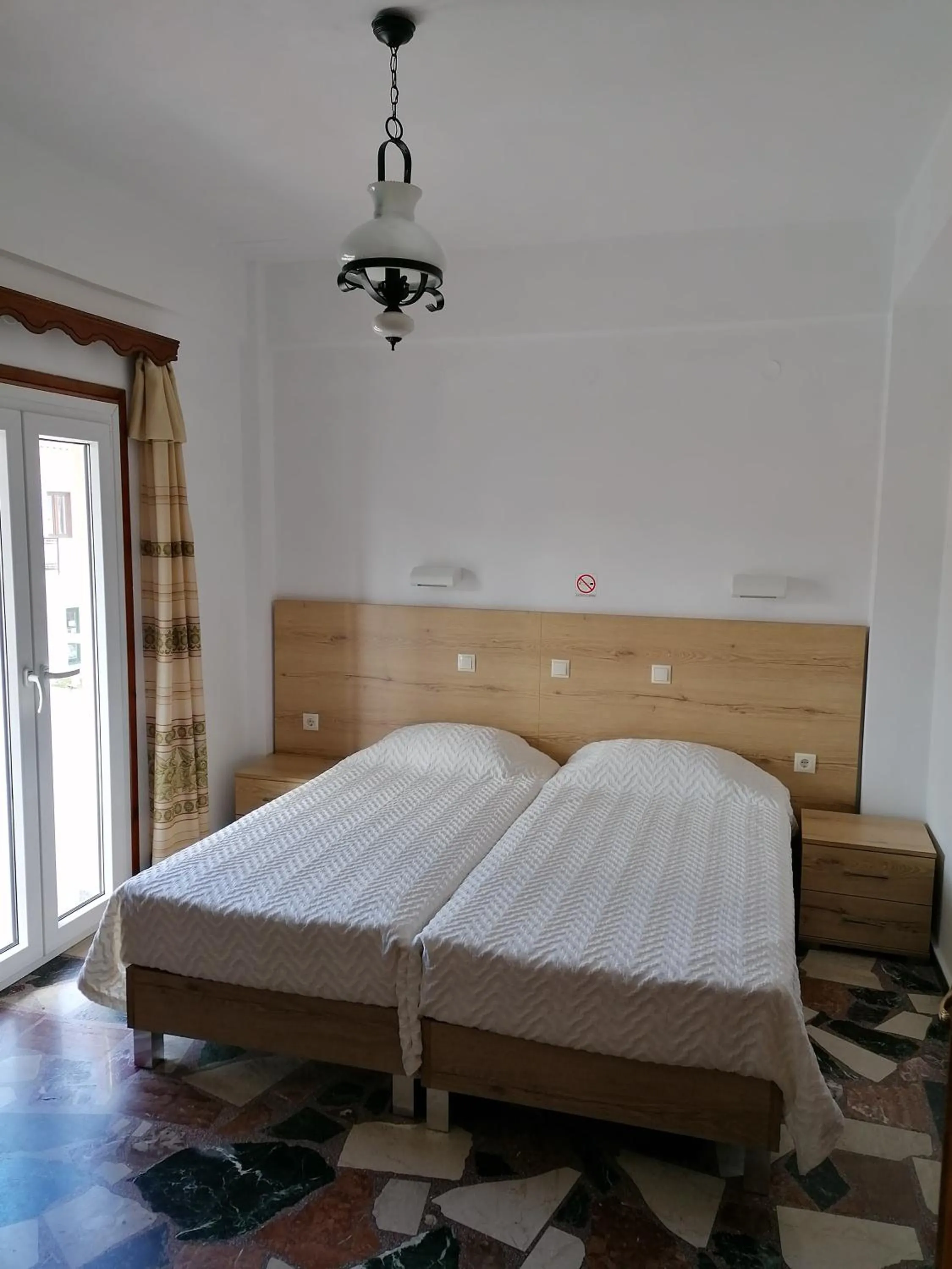 Bed in Lefteris Rooms