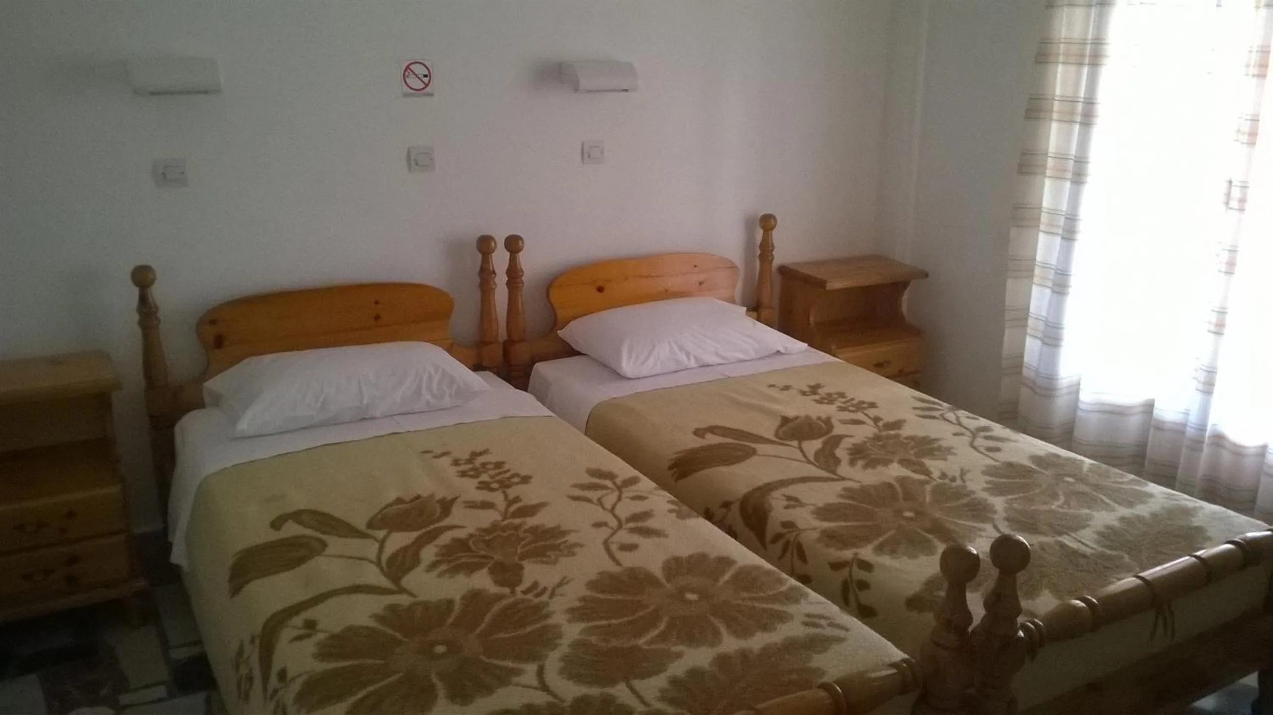 Bed in Lefteris Rooms