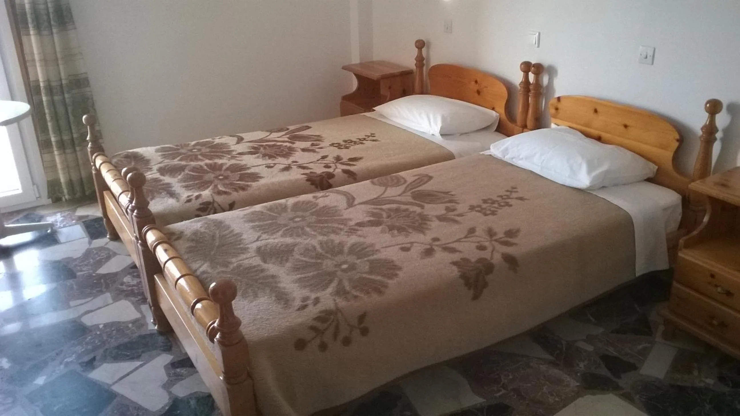 Bed in Lefteris Rooms