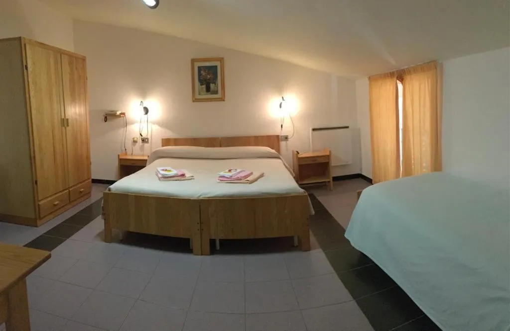 Bed in Hotel Ristorante Gusana