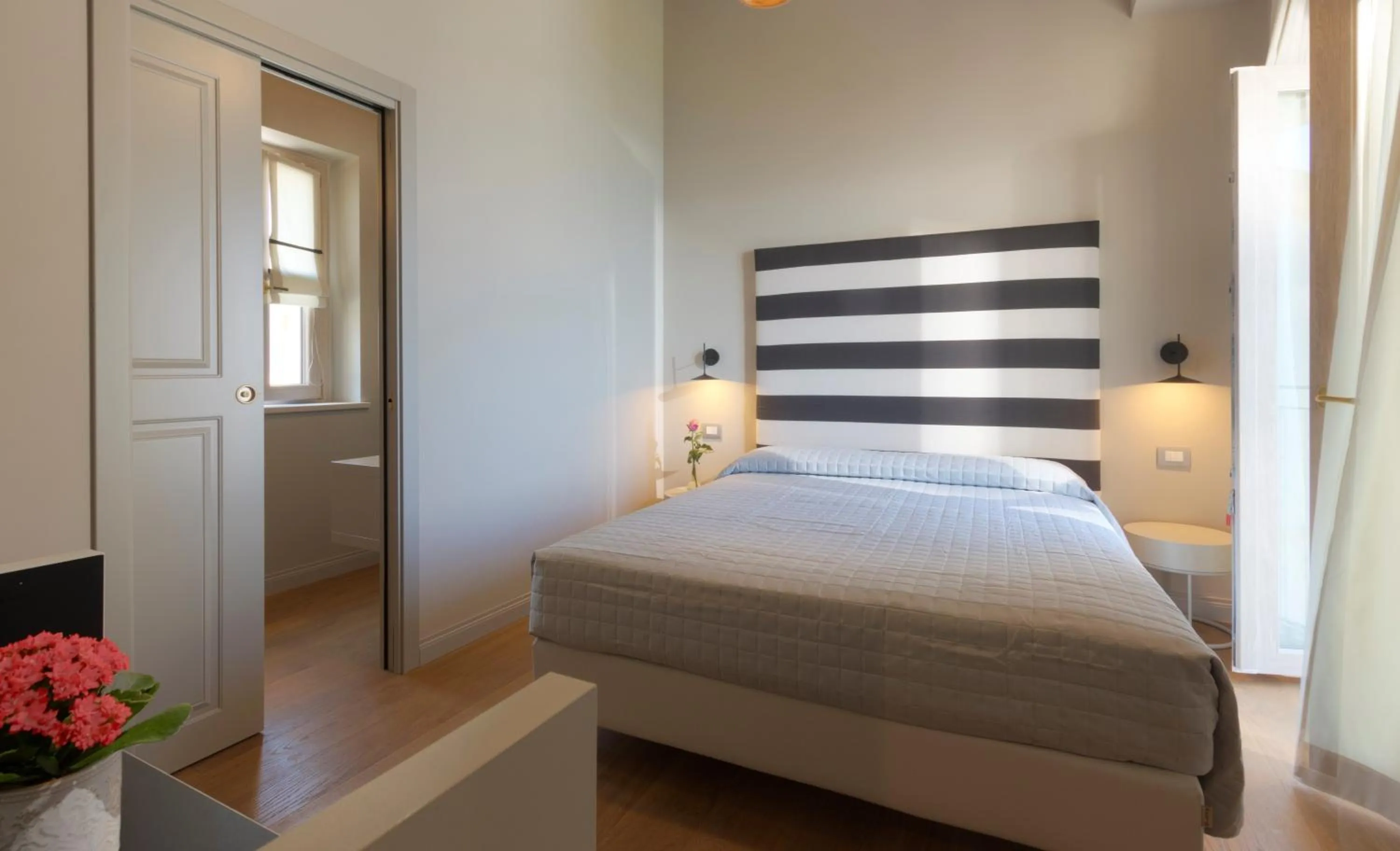 Bed in Diecidodici BoutiqueRooms