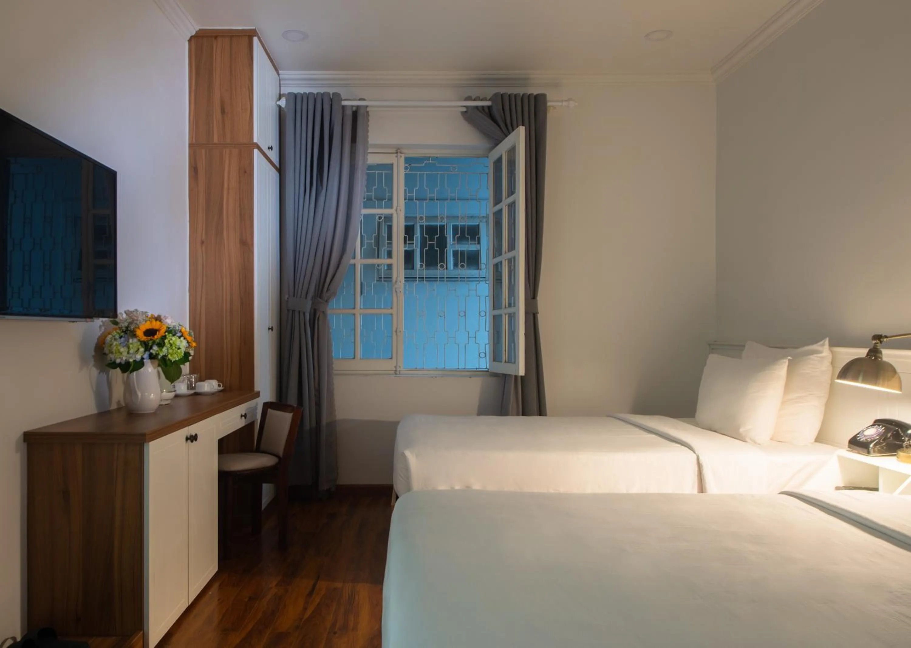 Bed in Le Soleil Boutique Hotel