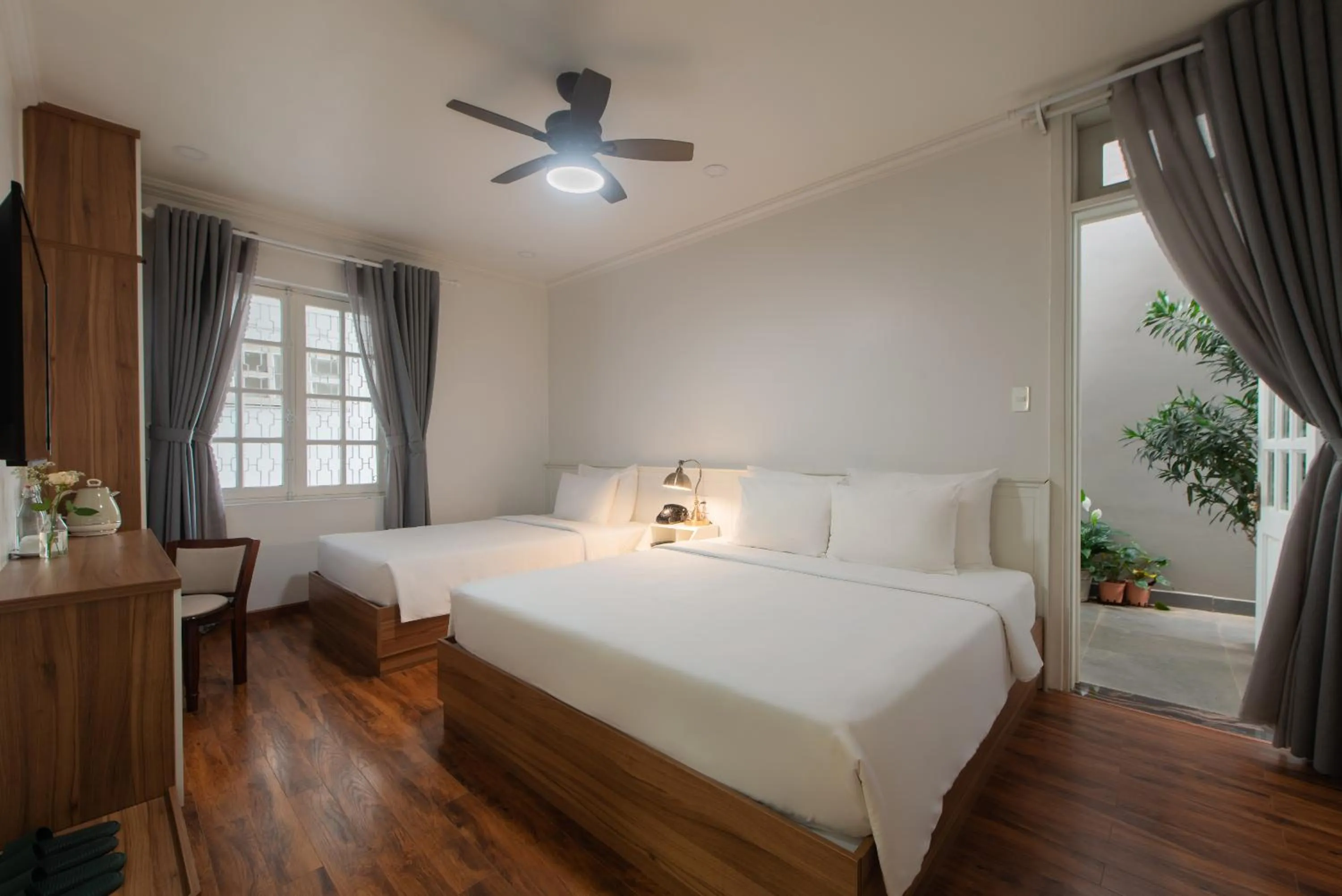 Bed in Le Soleil Boutique Hotel