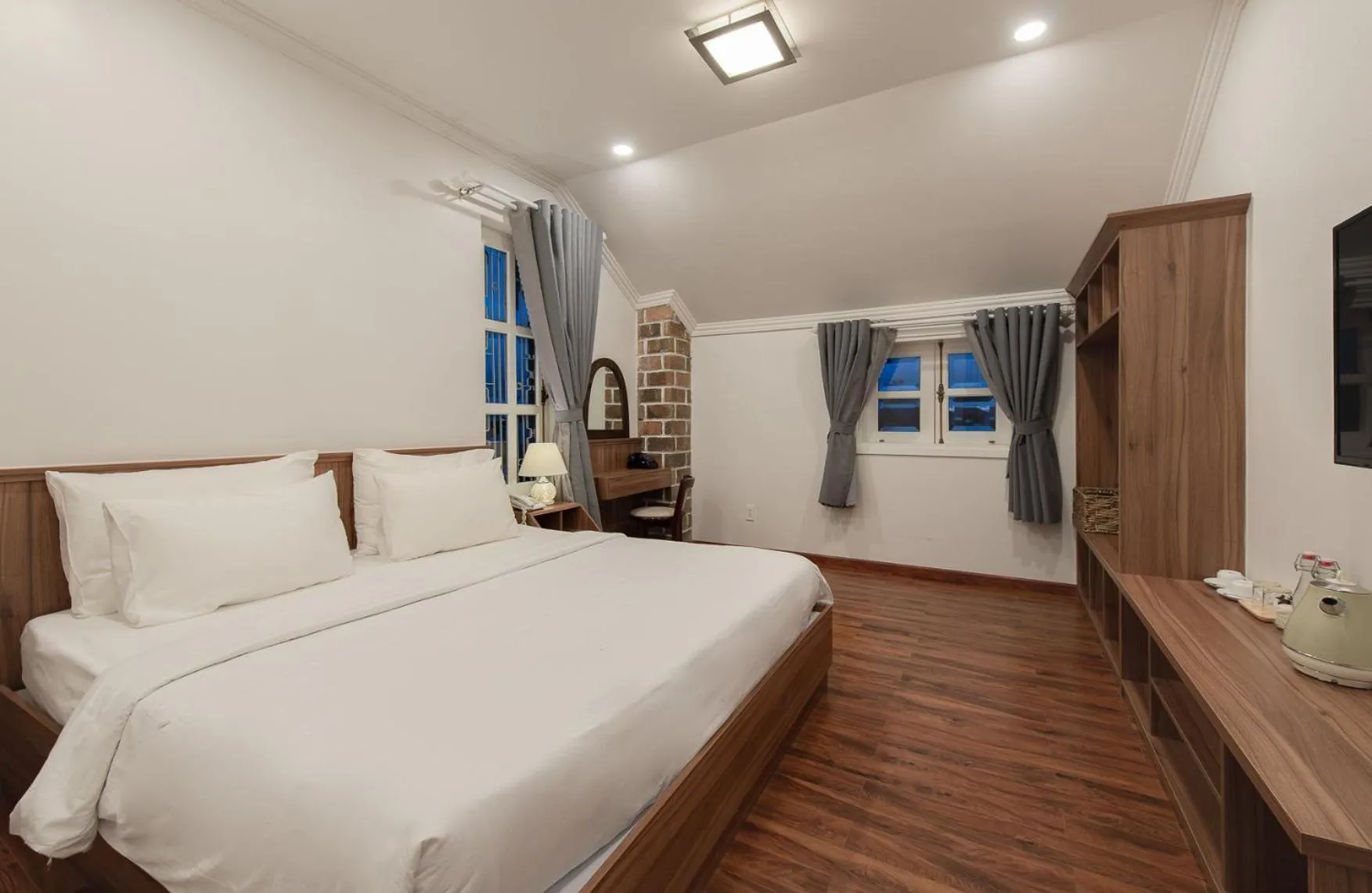 Bed in Le Soleil Boutique Hotel