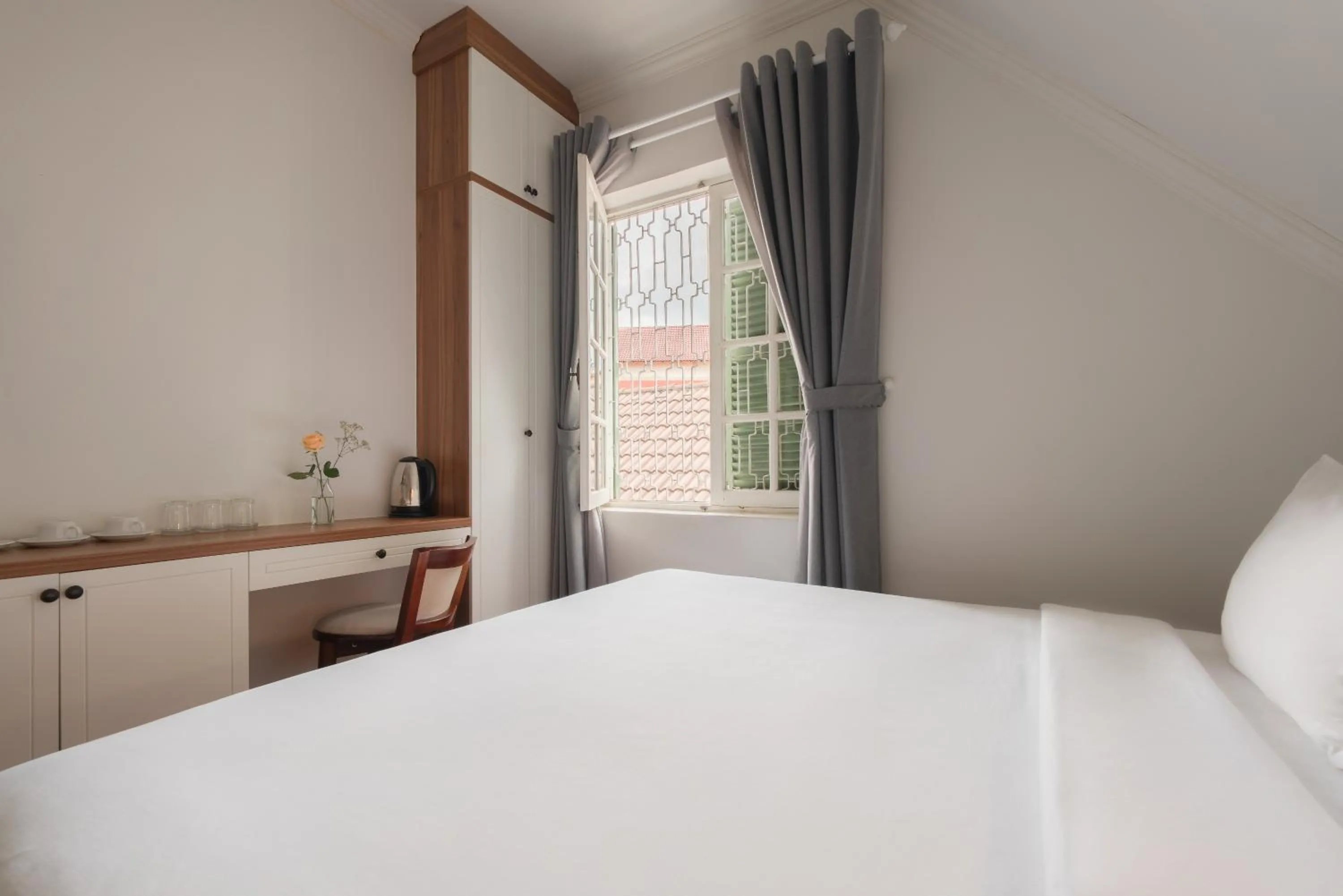 Bed in Le Soleil Boutique Hotel