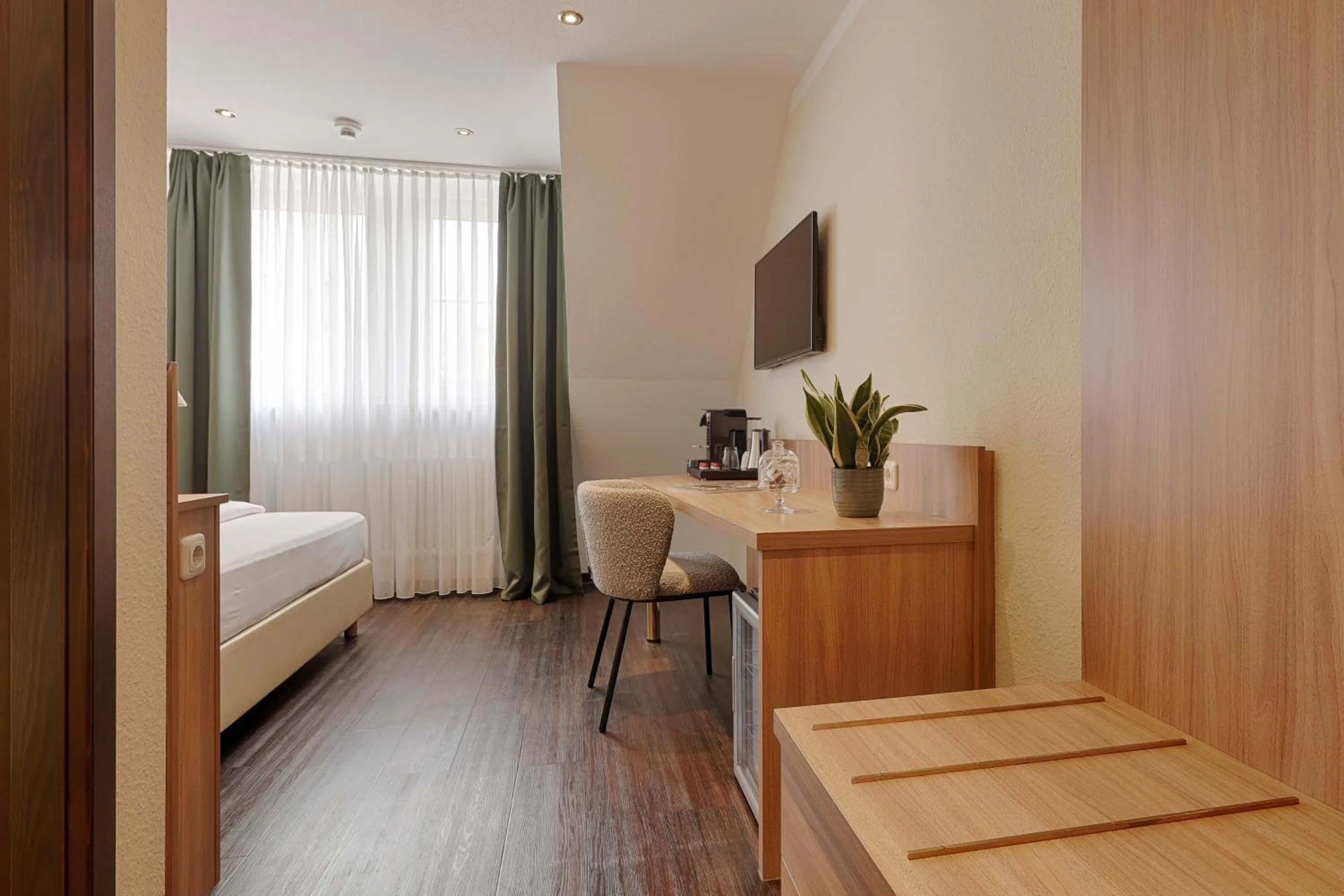 Photo of the whole room, Bed in Hotel Fischzucht in Würzburg