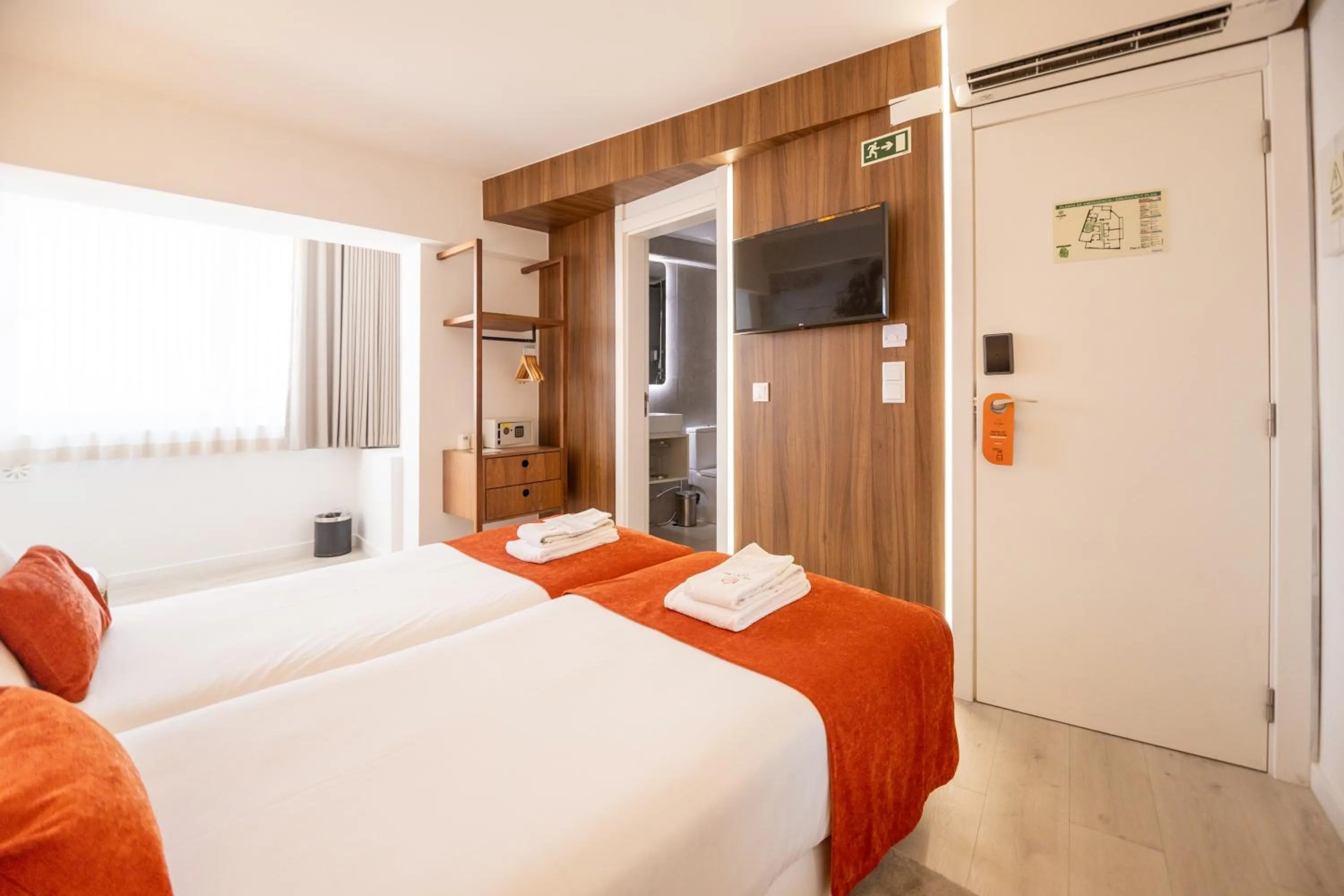 Bed in The ICONS Lisbon Hotel