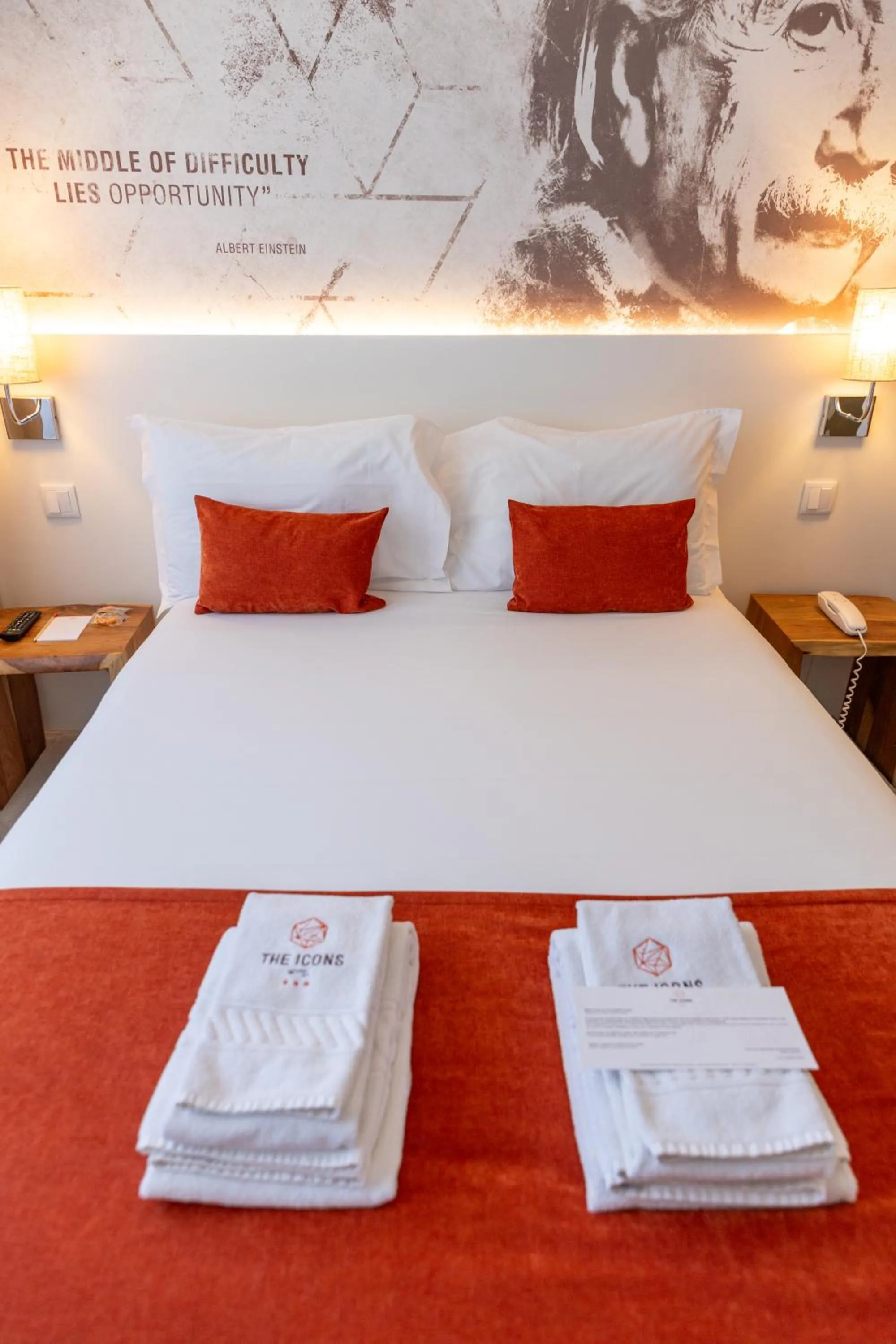 Bed in The ICONS Lisbon Hotel