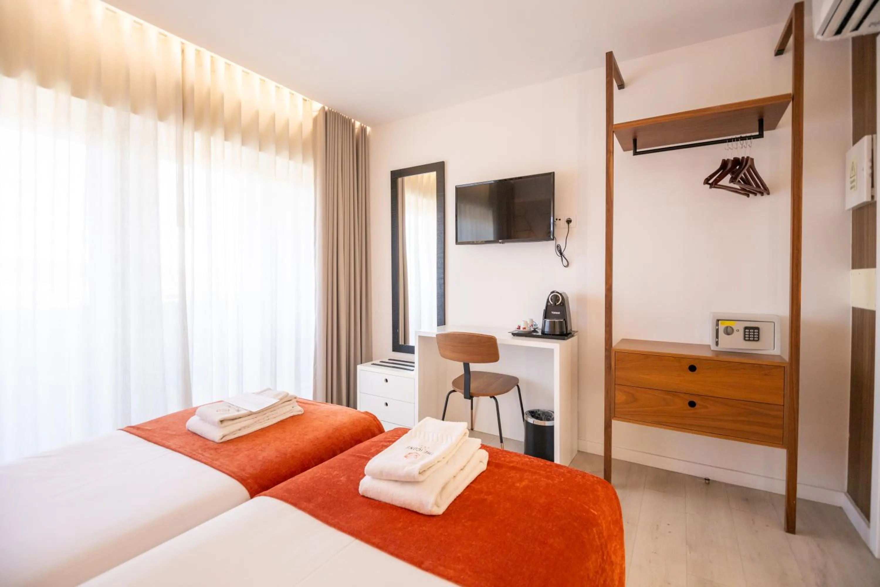 Bed in The ICONS Lisbon Hotel