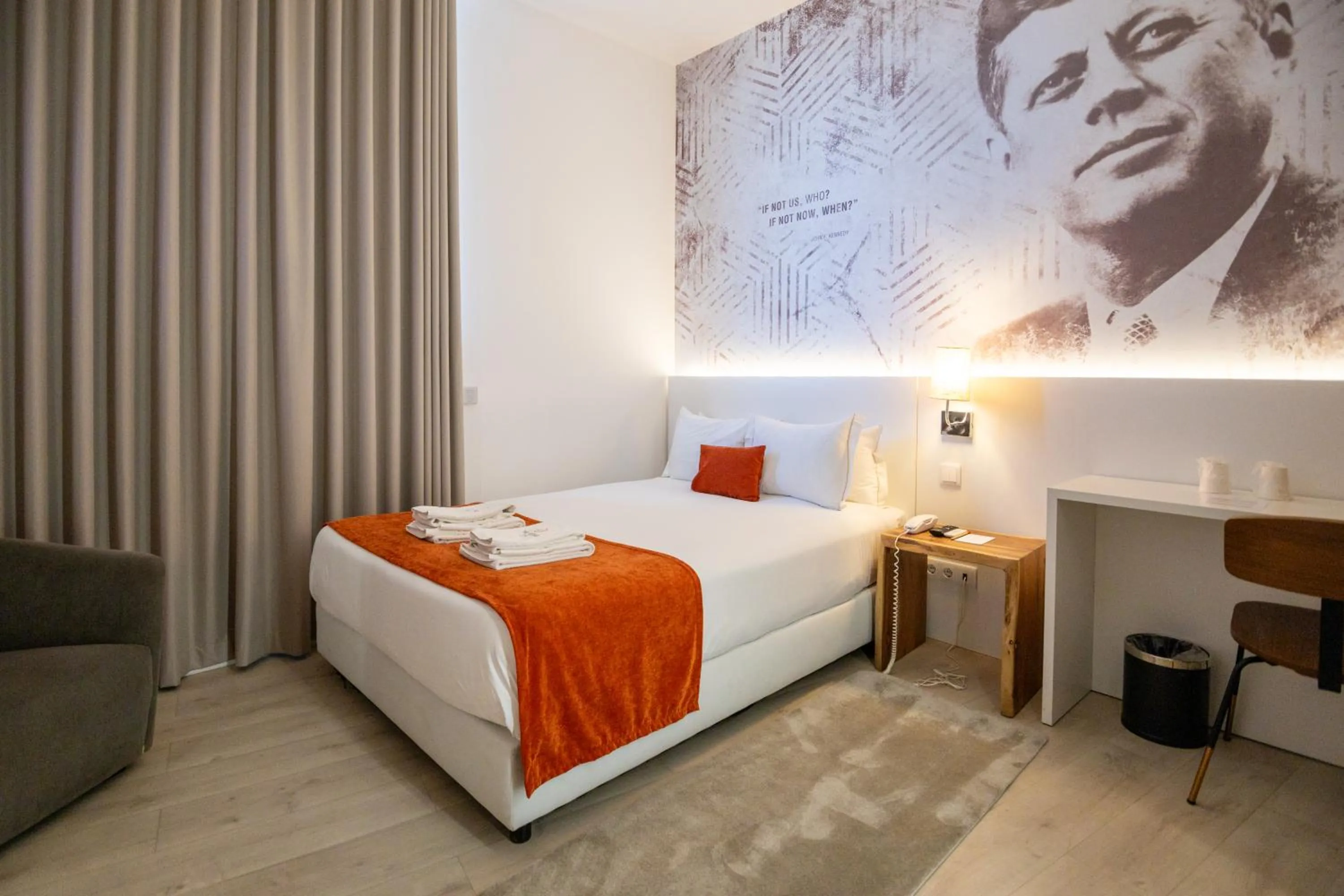 Bed in The ICONS Lisbon Hotel