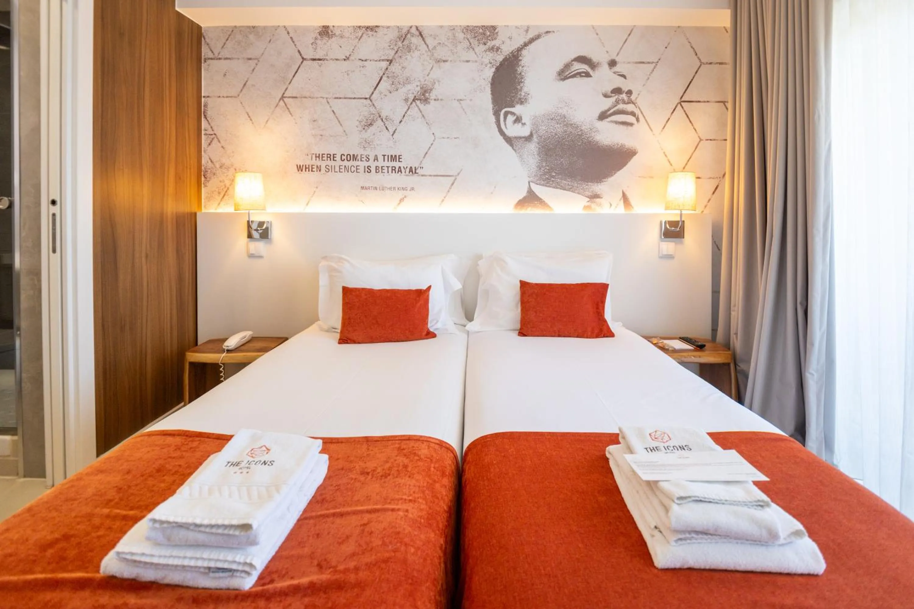 Bed in The ICONS Lisbon Hotel