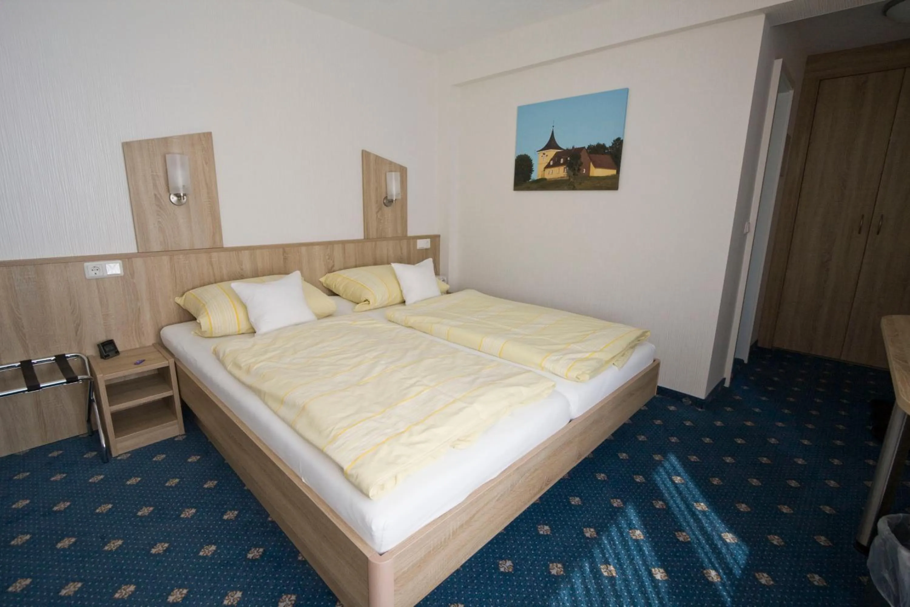 Bed in Mein Vierjahreszeiten Hotel Garni Superior