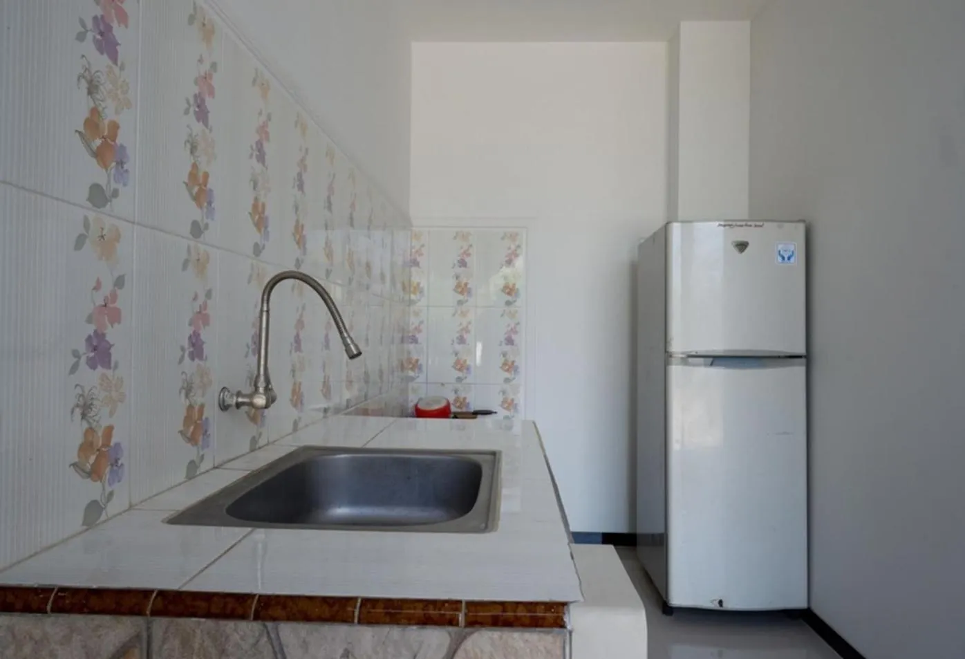 Communal kitchen in Villetta House Syariah