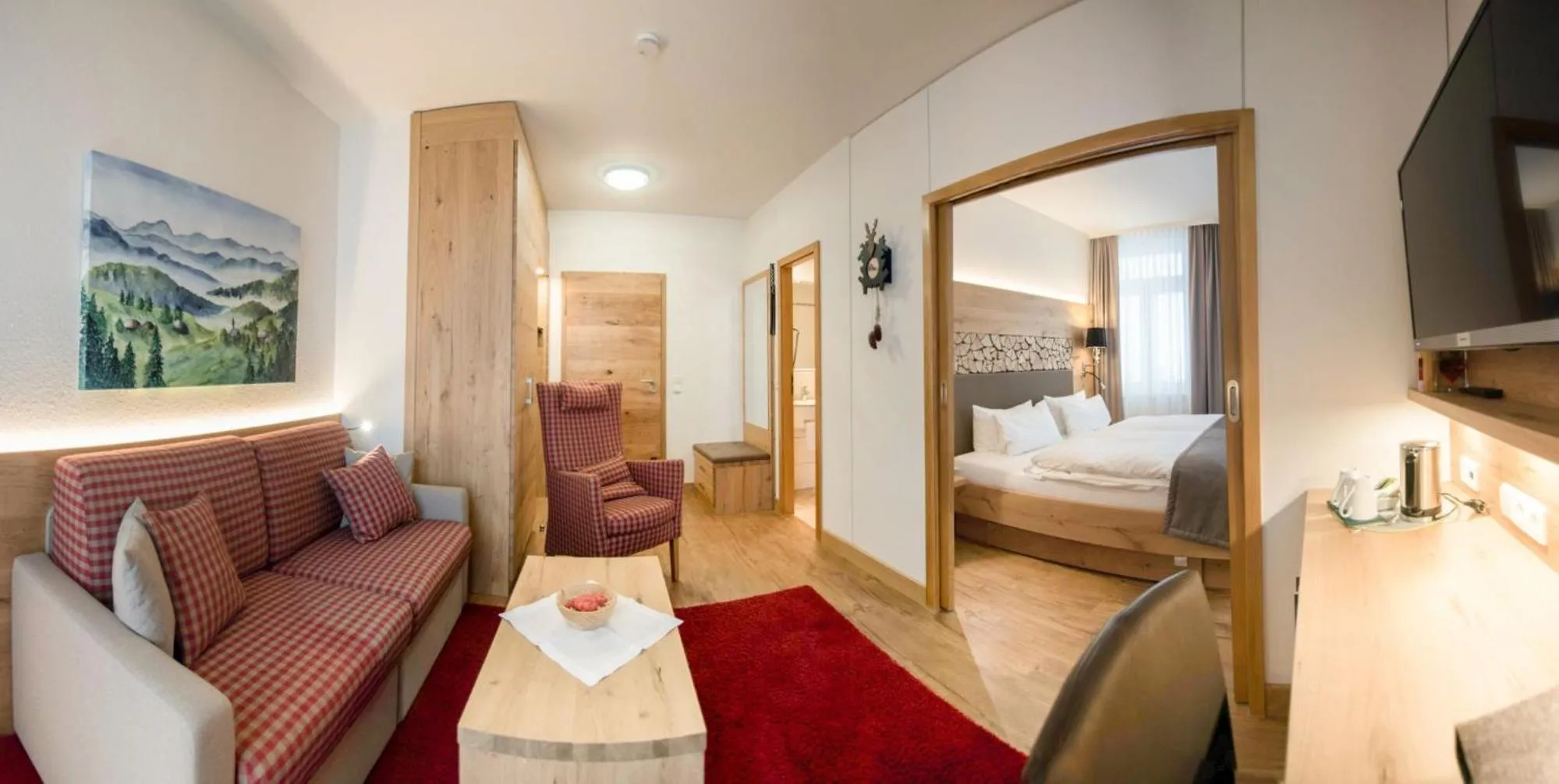 Living room, Bed in Das Waldhotel - Genuss & Wellness am Notschreipass