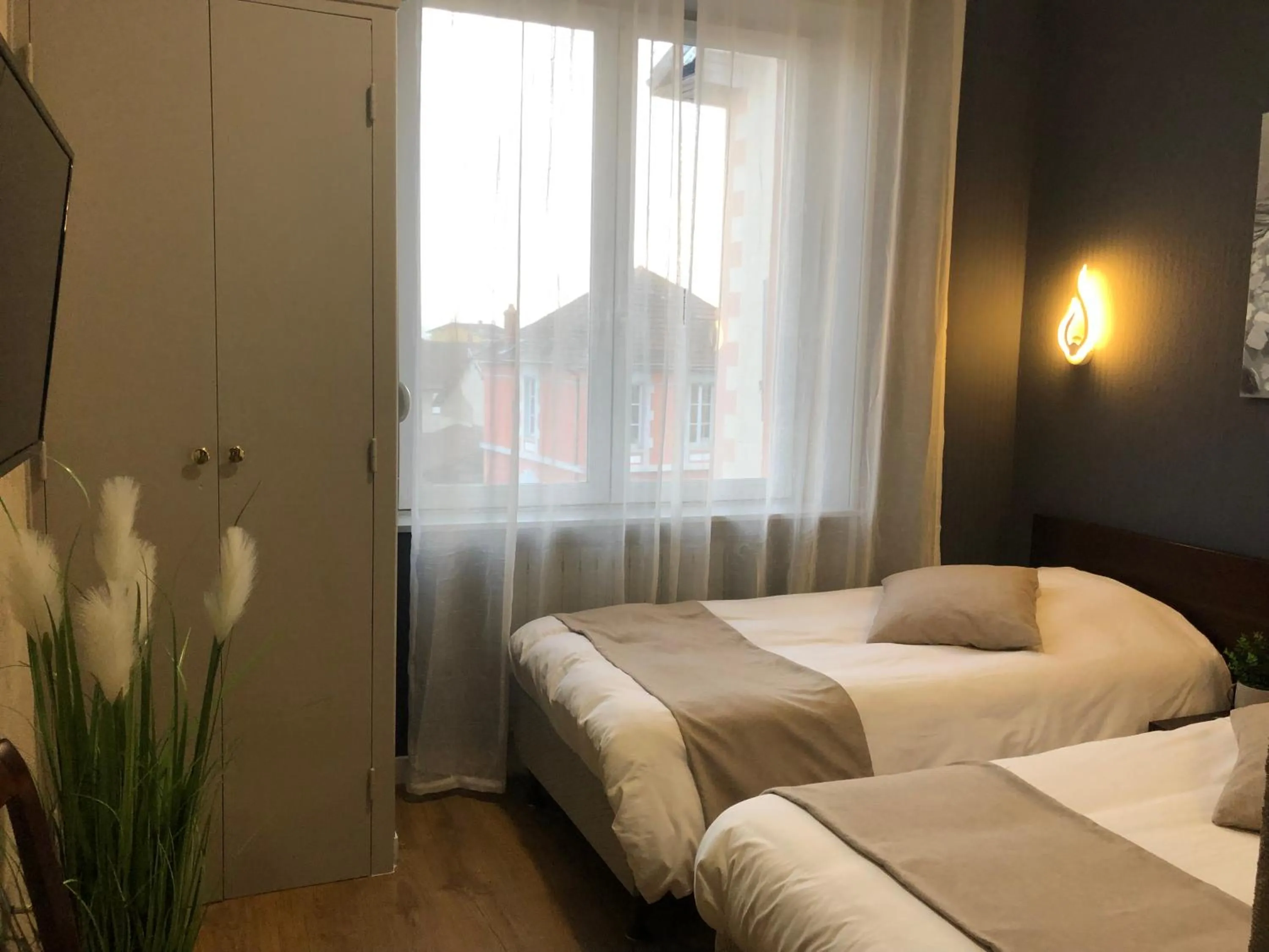 Bed in L'EMBLEME - BOUTIQUE HOTEL