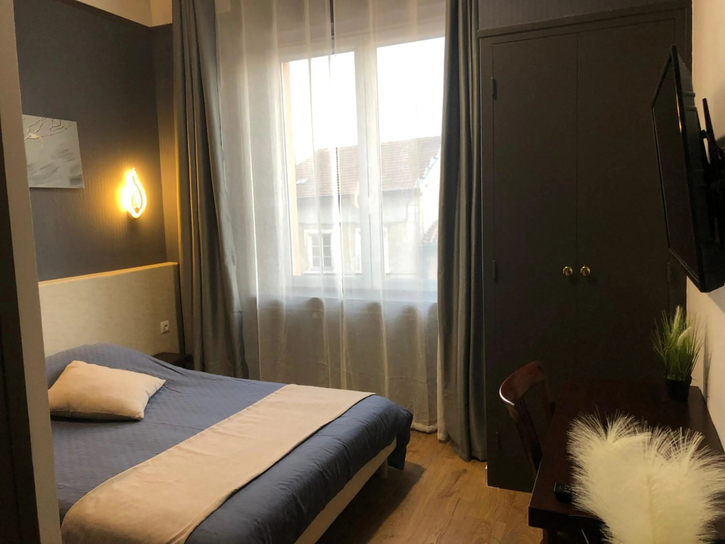 Bed in L'EMBLEME - BOUTIQUE HOTEL