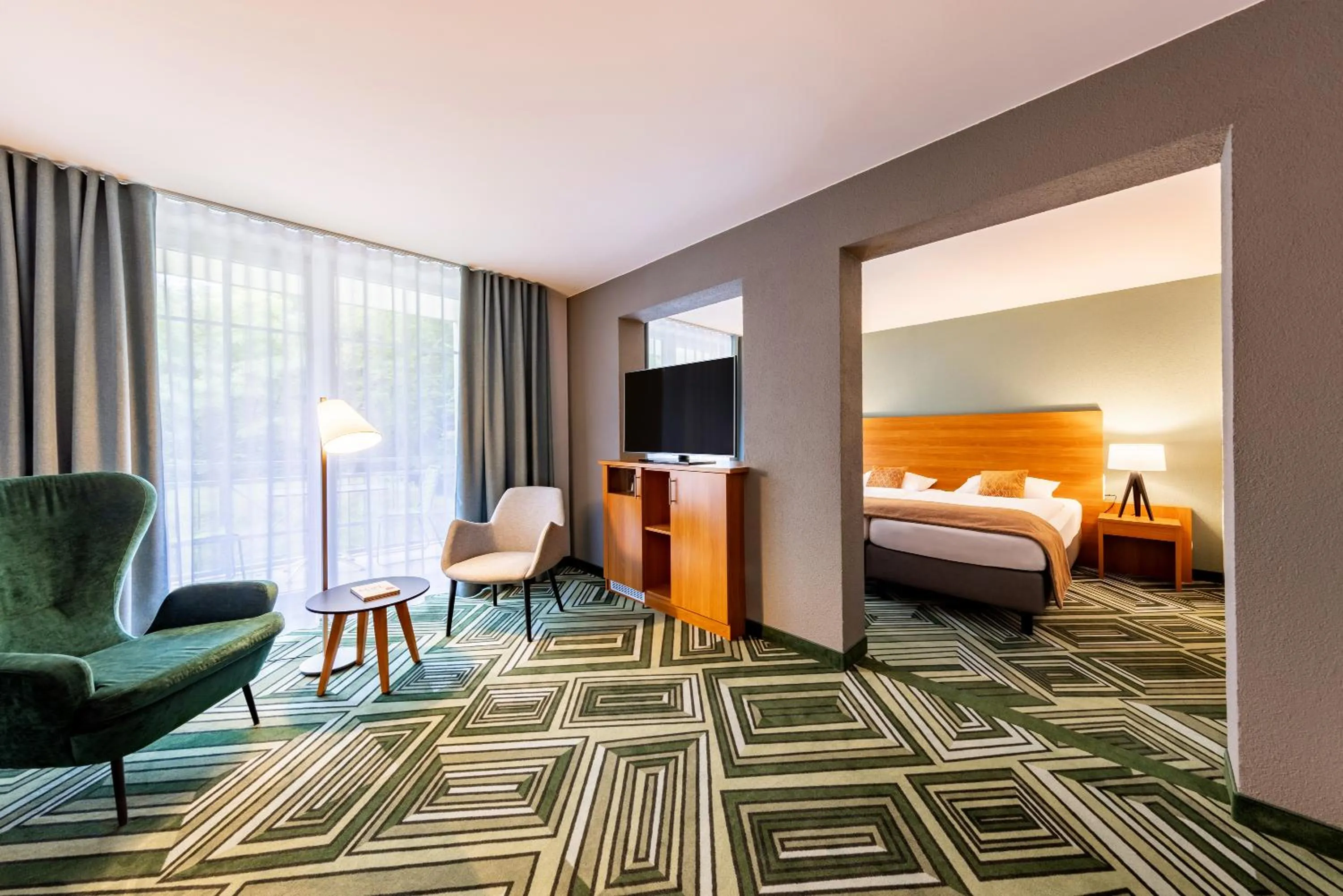 Living room, Bed in Parkhotel Maximilian Ottobeuren