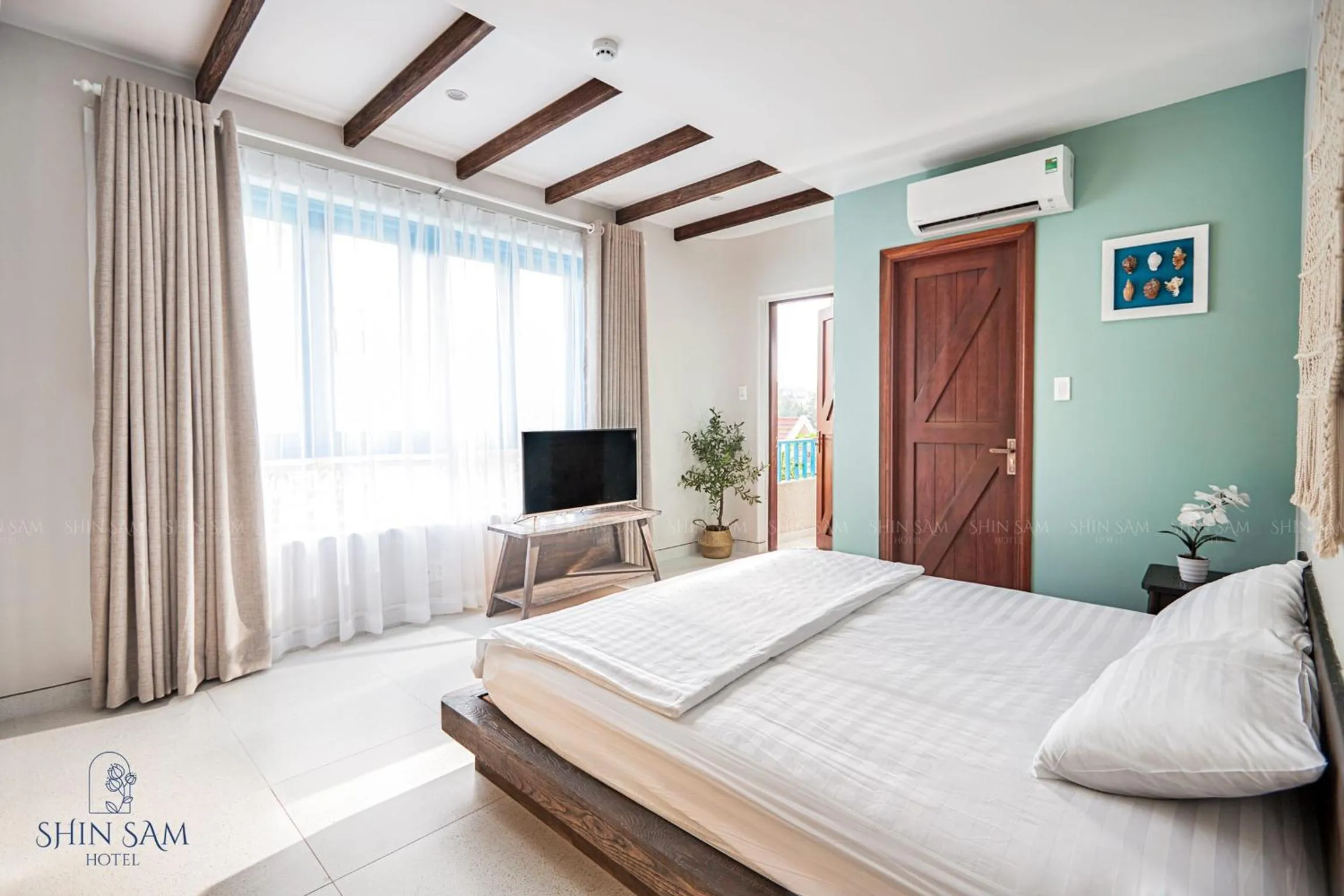 Bed in Shin Sam Boutique Hotel