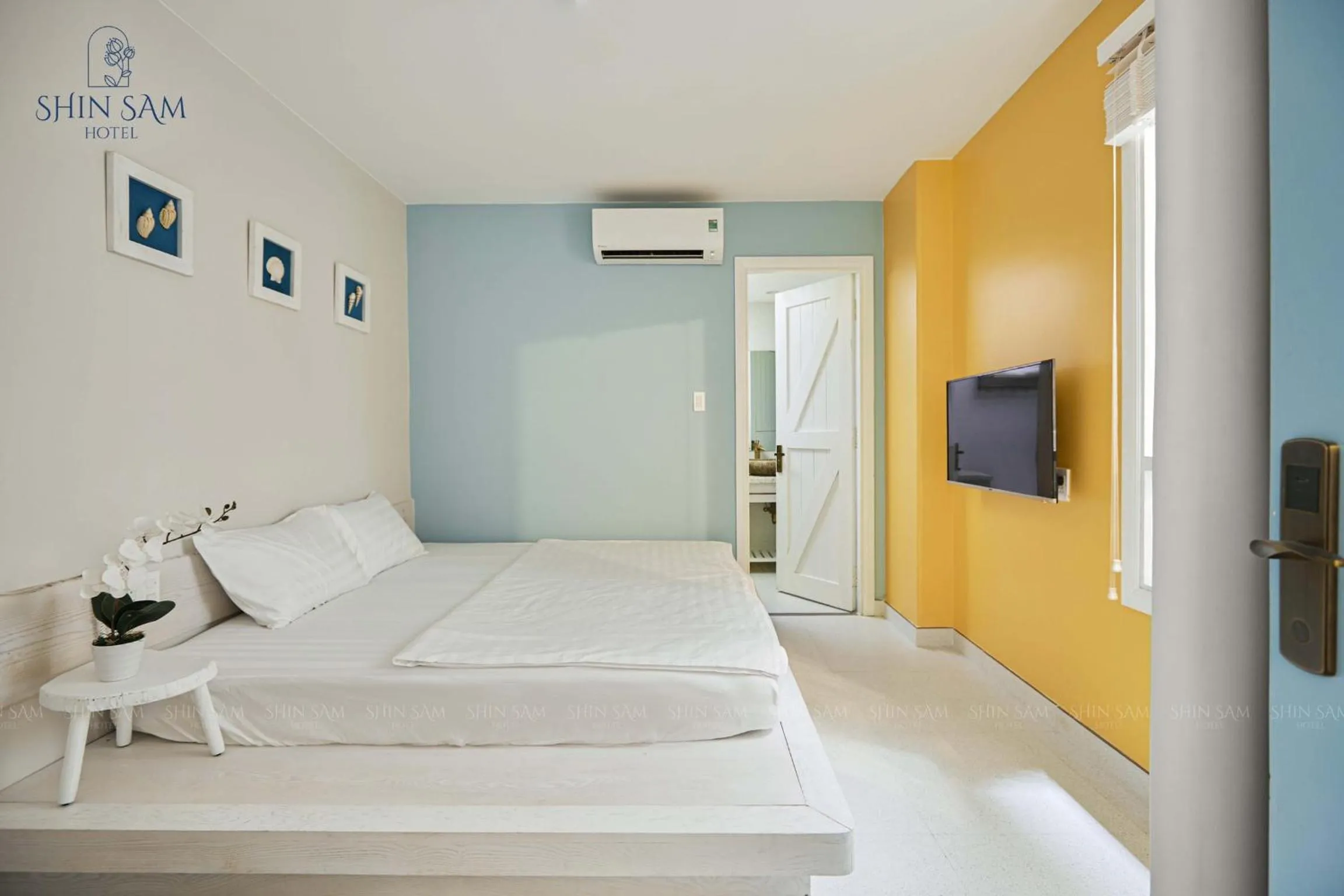 Bed in Shin Sam Boutique Hotel