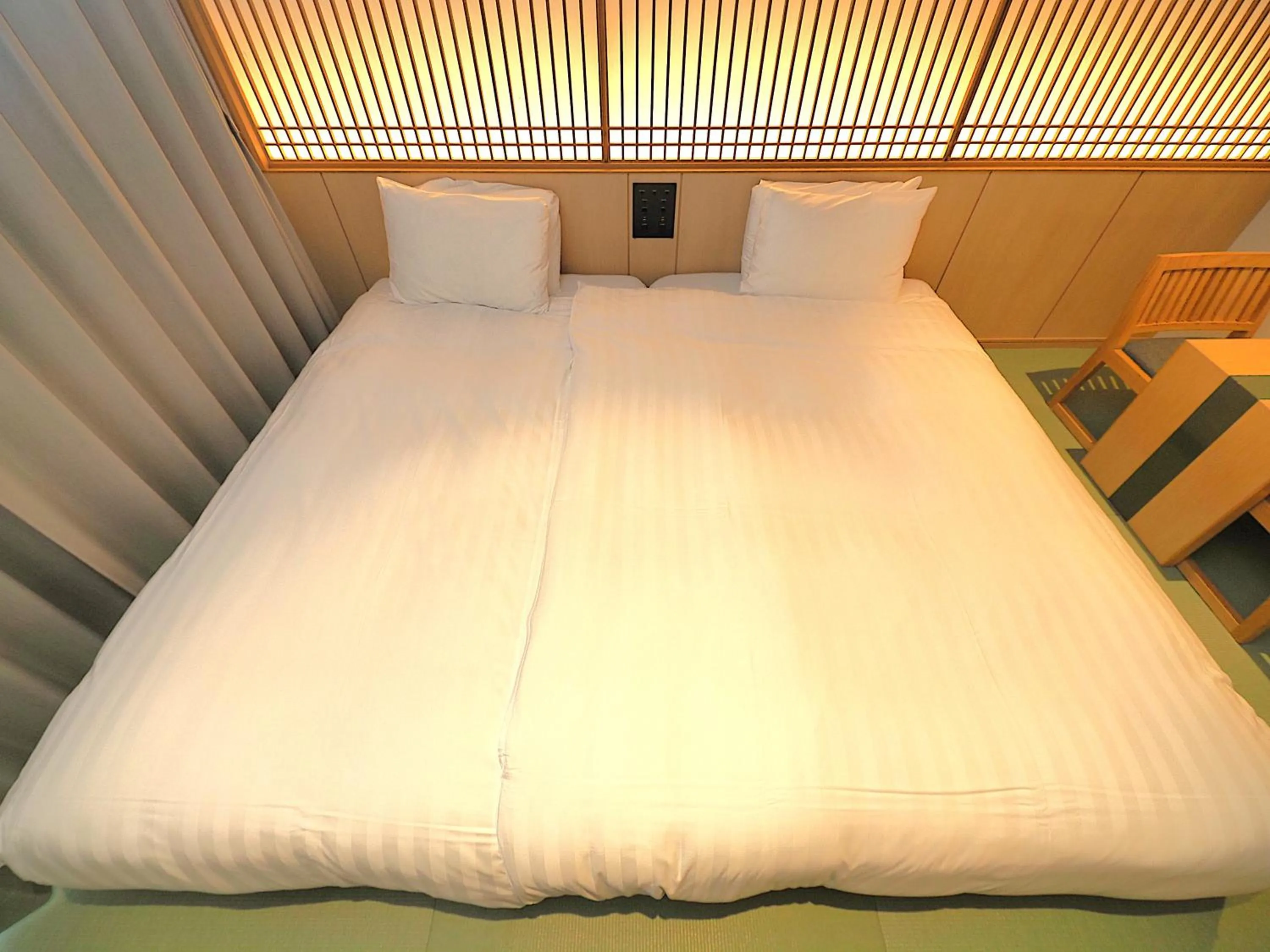 Bed in Henn na Hotel Premier Kyoto Gojo Karasuma -Formerly Watermark Hotel Kyoto-