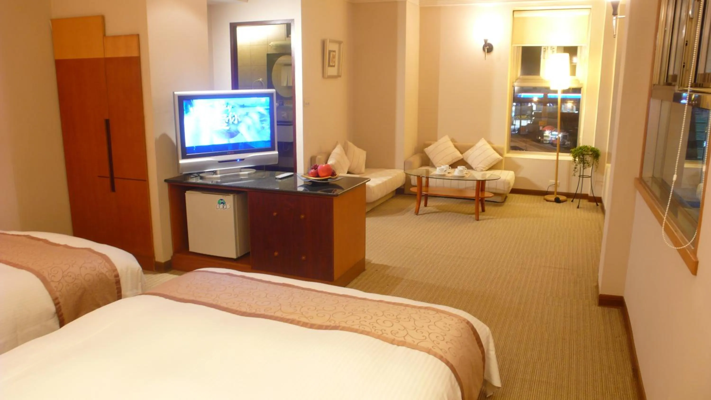 Photo of the whole room, Bed in Tian Long Hotel