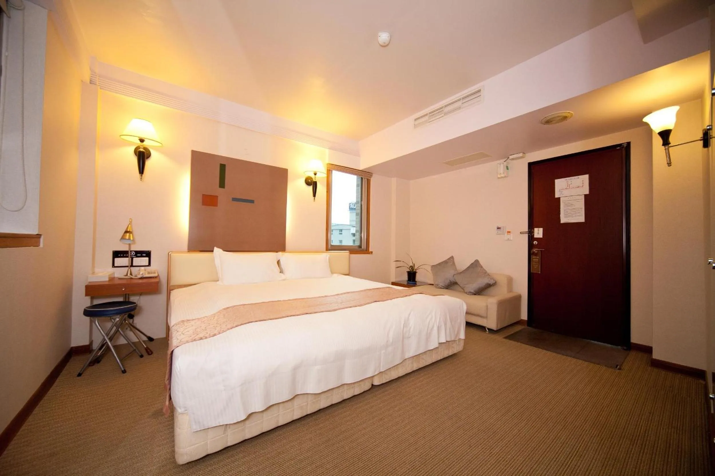 Photo of the whole room, Bed in Tian Long Hotel