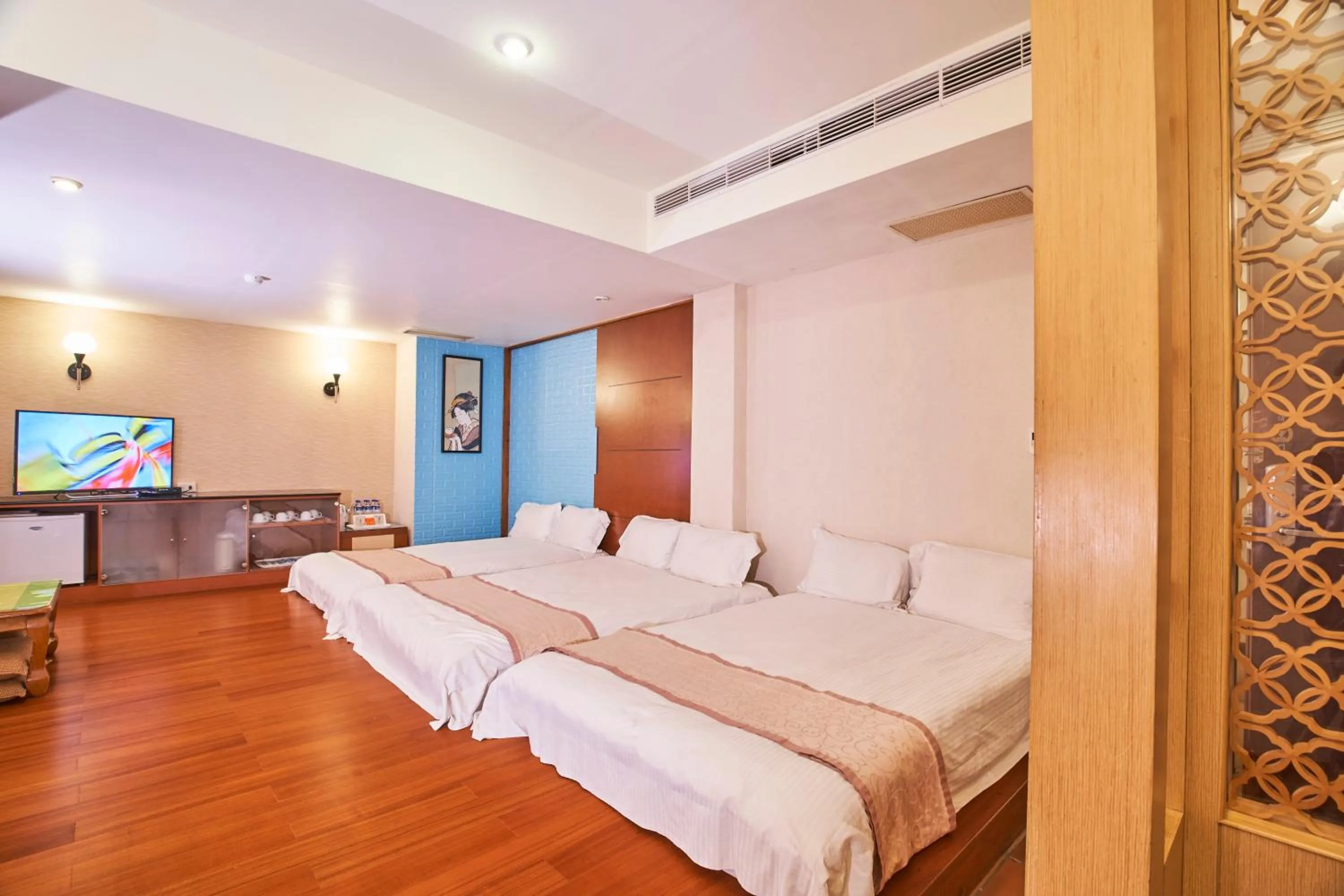 Bed in Tian Long Hotel