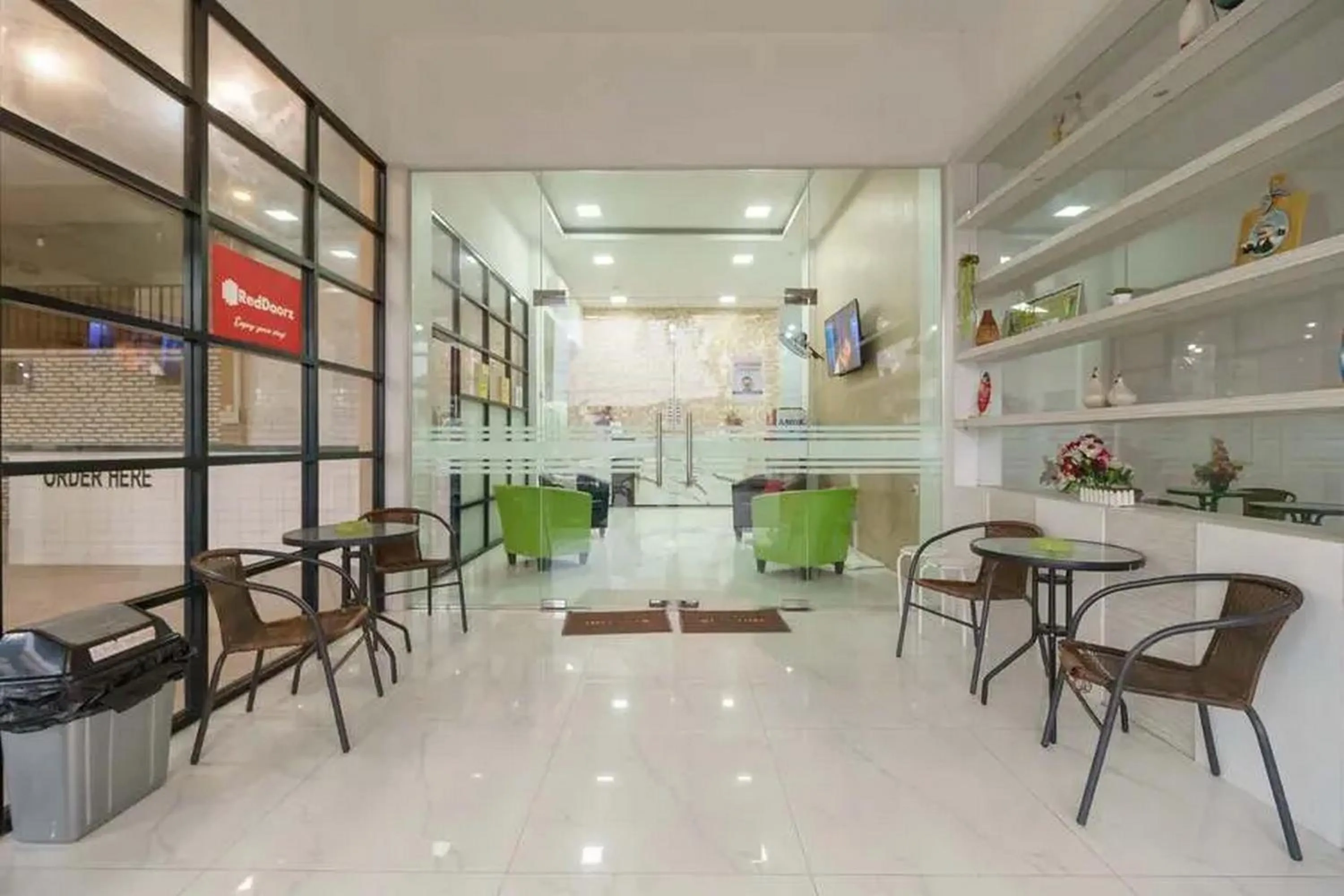 Seating area in RedDoorz Plus @ Cemara Asri Medan