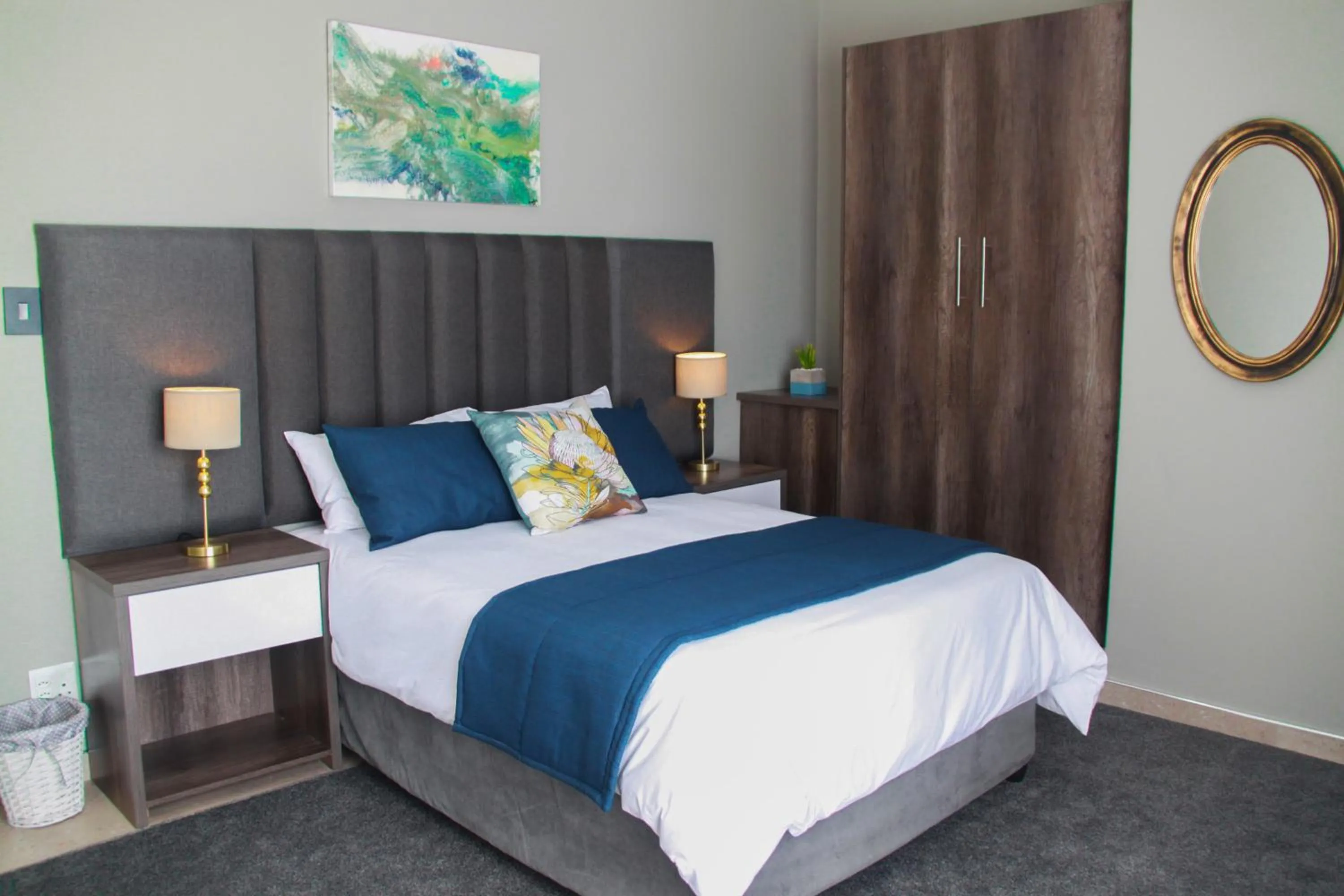 Bed in The Cato Suites Hotel