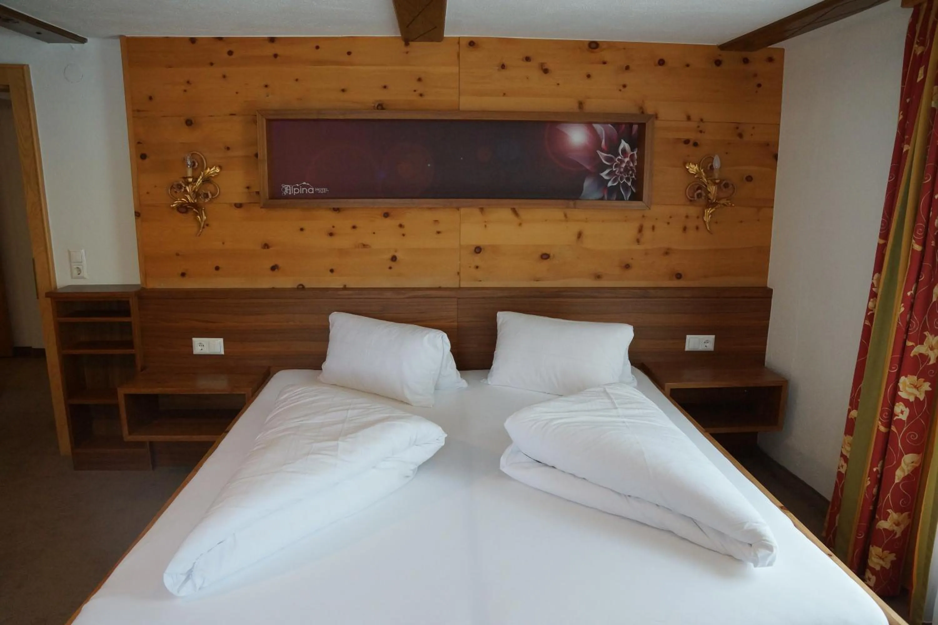 Bed in Hotel Alpina