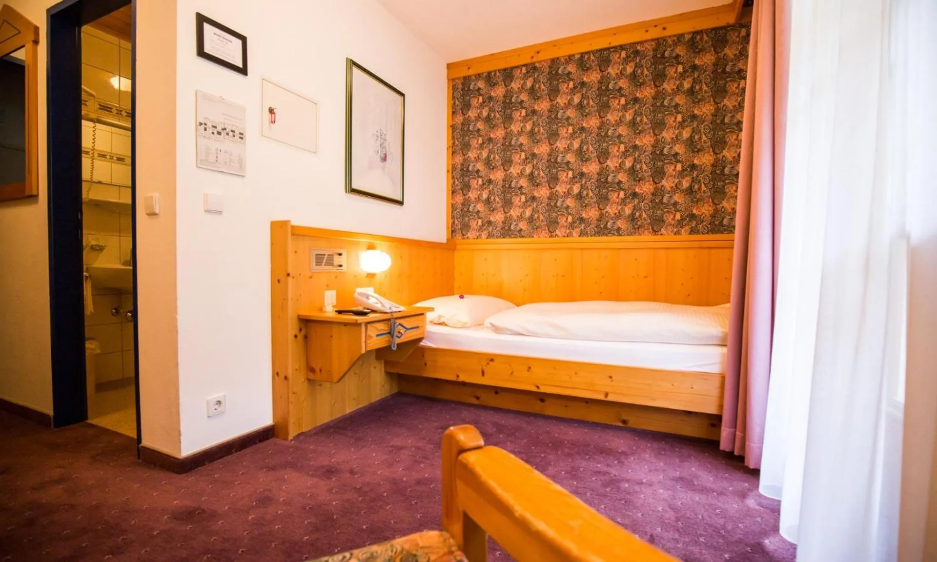 Bed in Hotel Enzian by Alpeffect Hotels