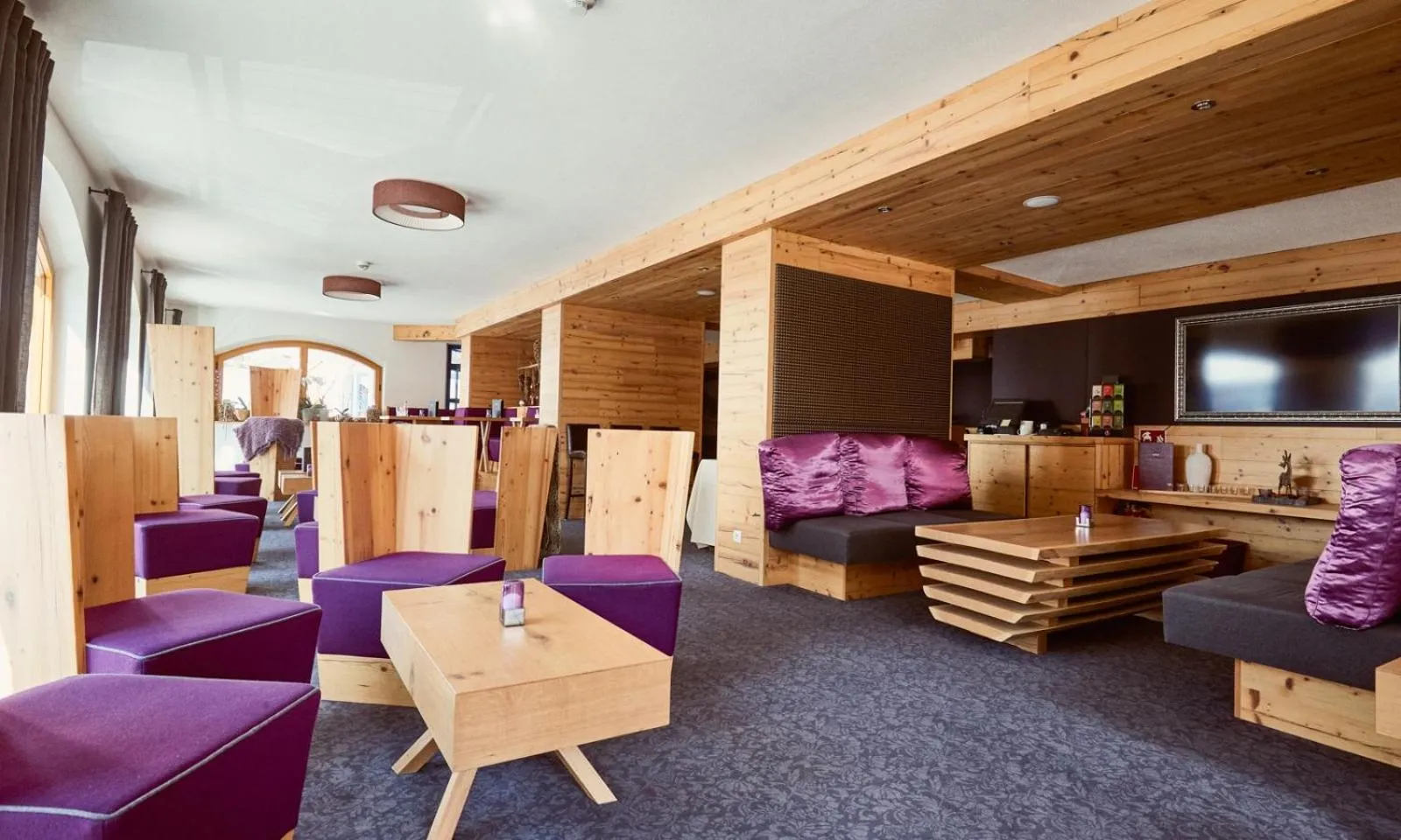 Seating area in Hotel Enzian by Alpeffect Hotels