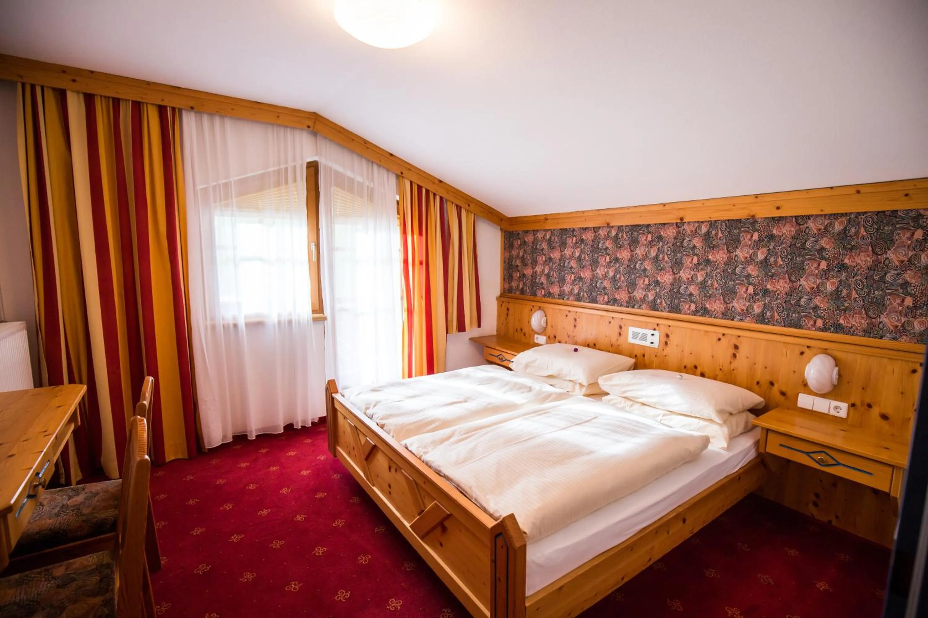 Bedroom, Bed in Hotel Enzian by Alpeffect Hotels