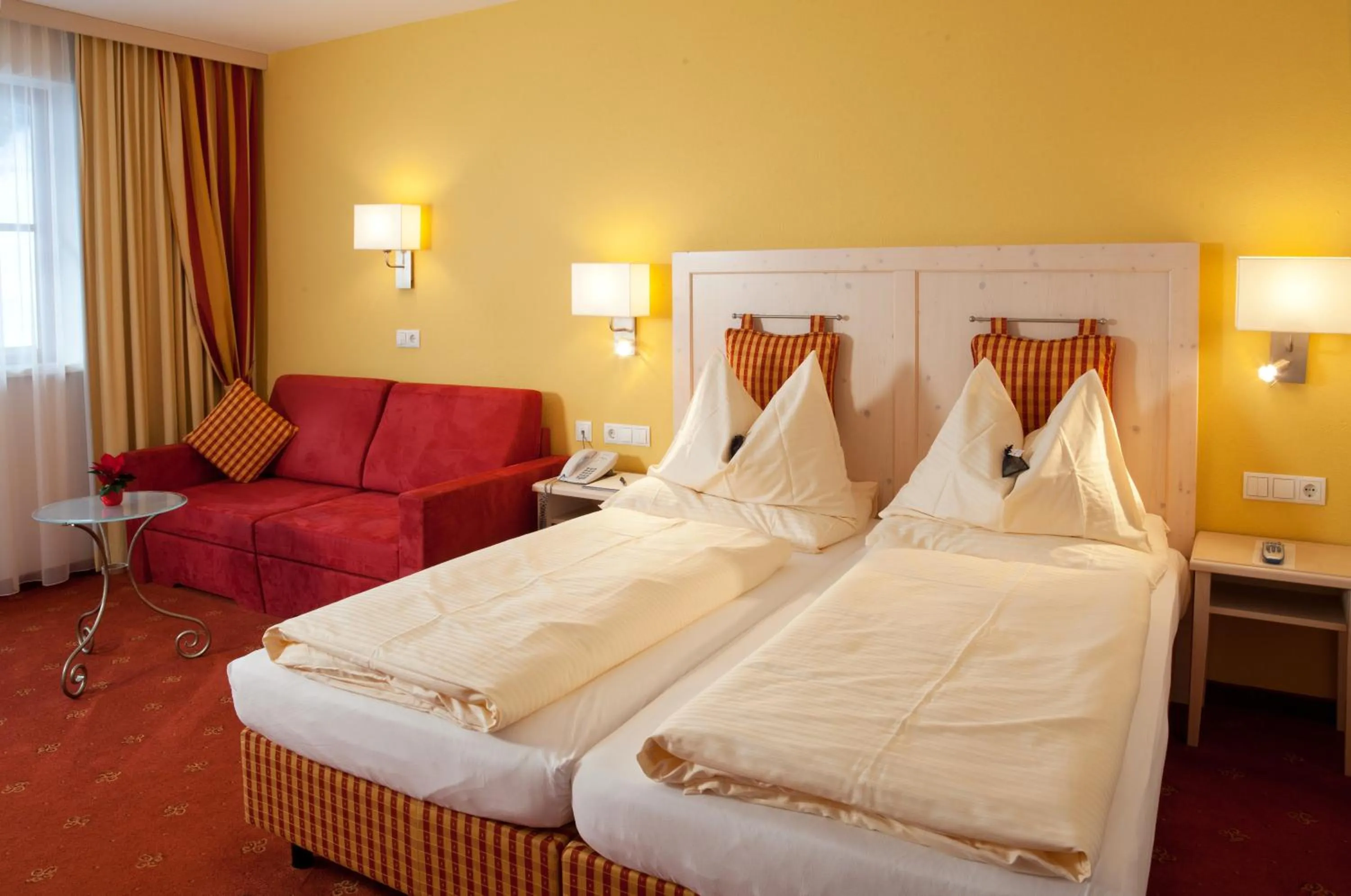 Bed in Hotel Enzian by Alpeffect Hotels