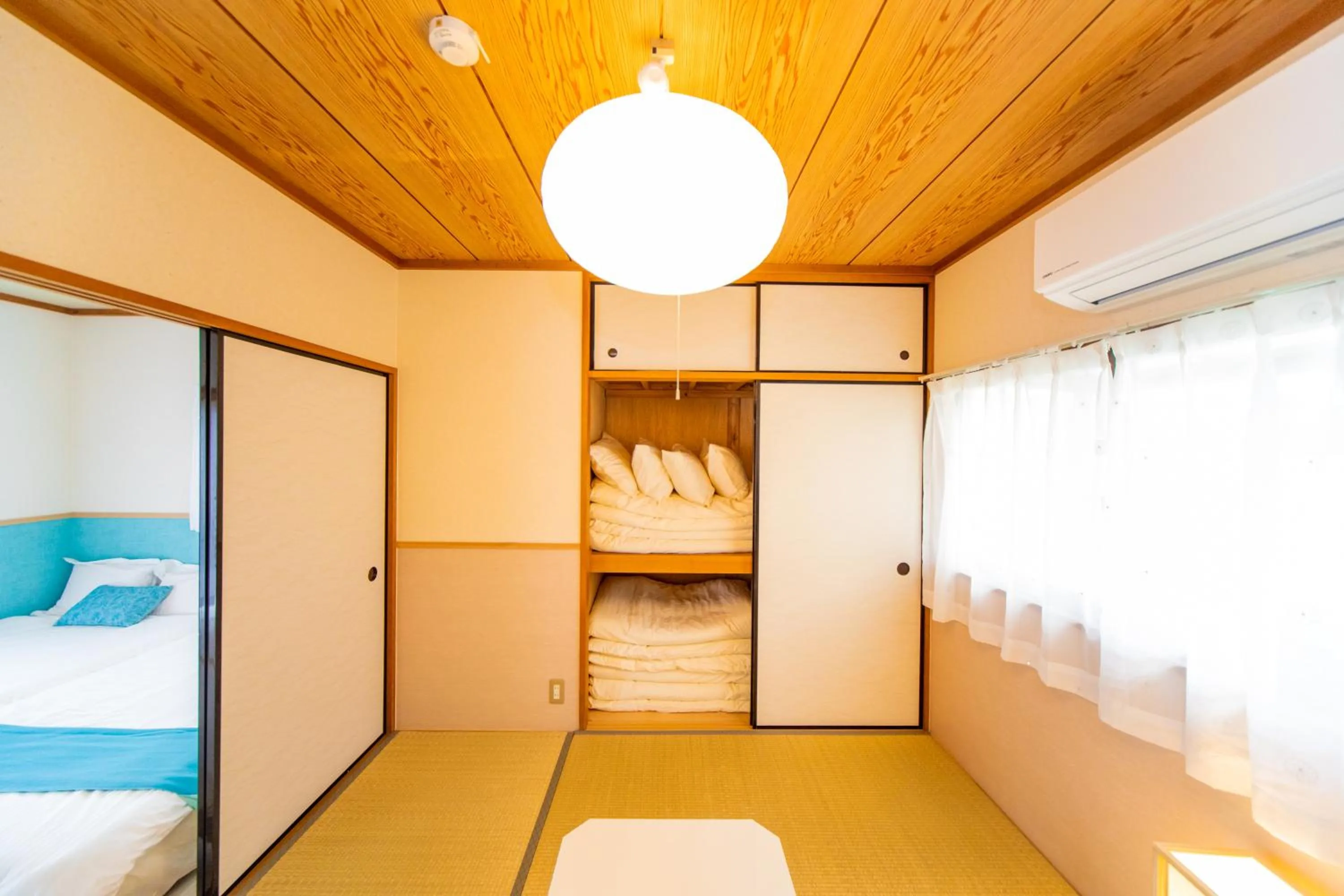 Bed in Awaji Central House in Kusumoto