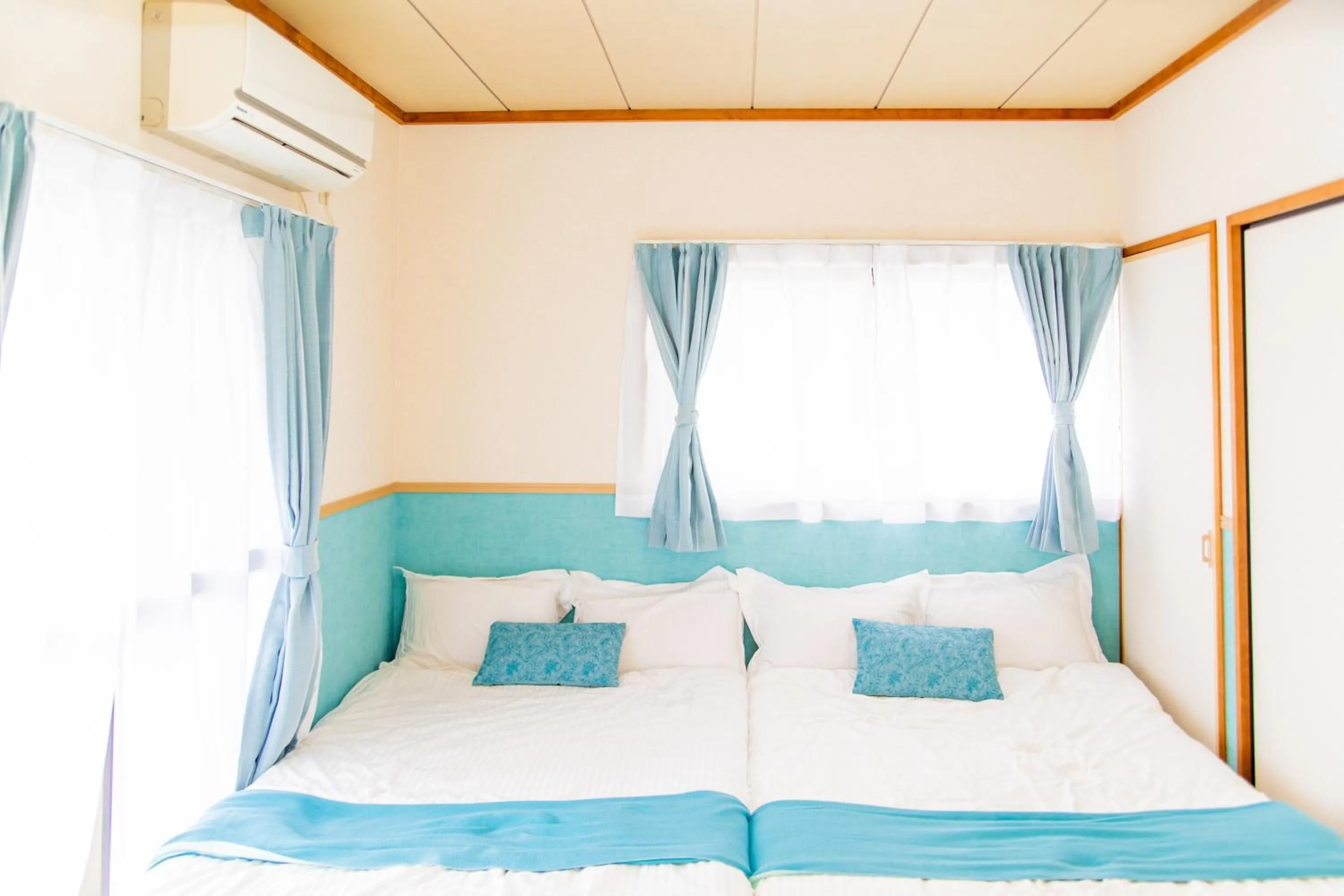 Bed in Awaji Central House in Kusumoto