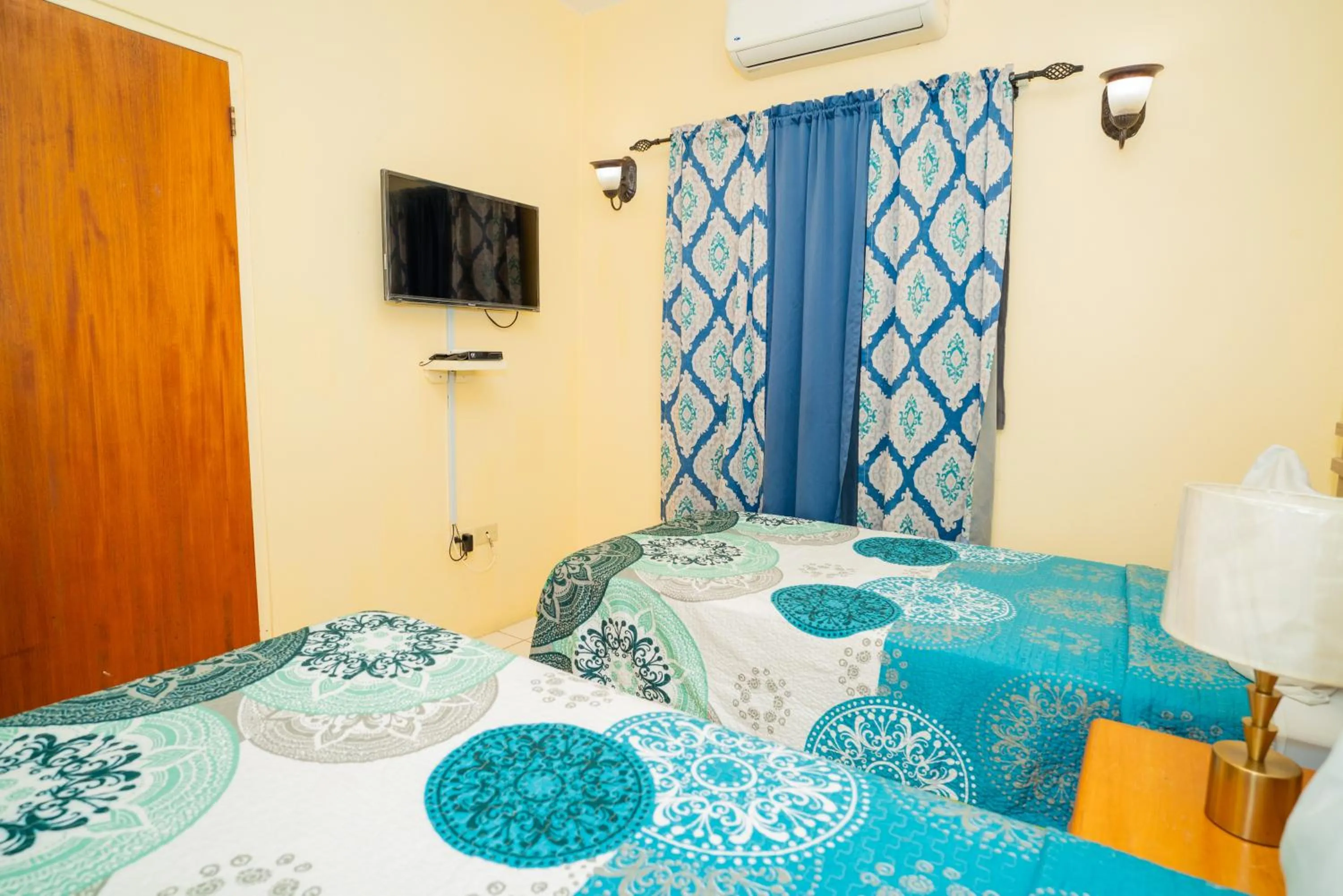 Bed in Connie's Comfort Suites